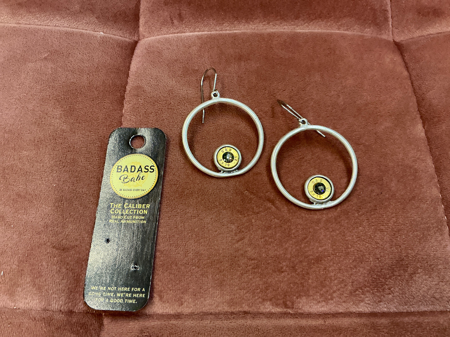 Silver hoop earrings with bezel details from BadAssBabe, showcasing their stylish and bold jewelry design.