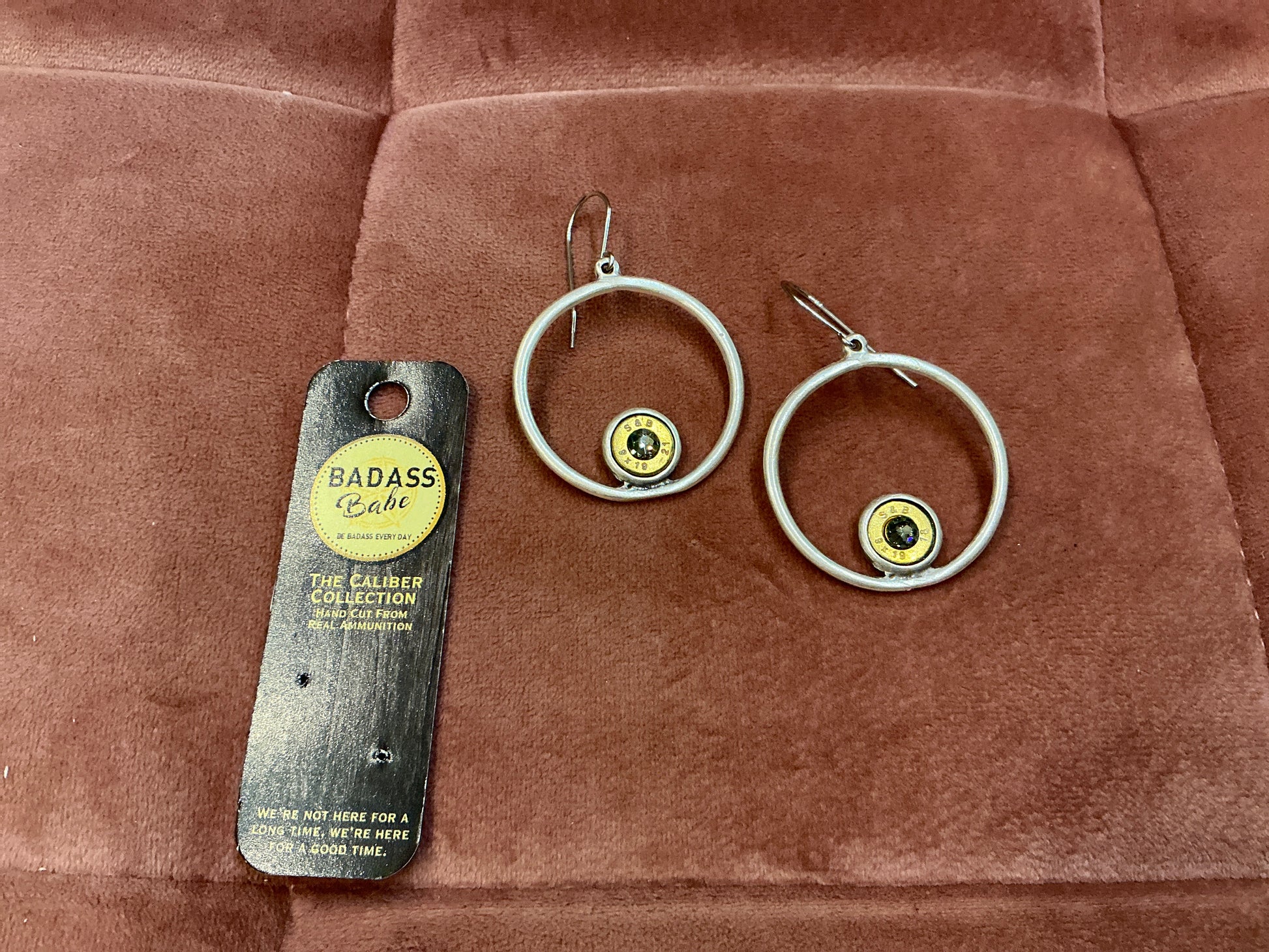 Silver hoop earrings with bezel details from BadAssBabe, showcasing their stylish and bold jewelry design.