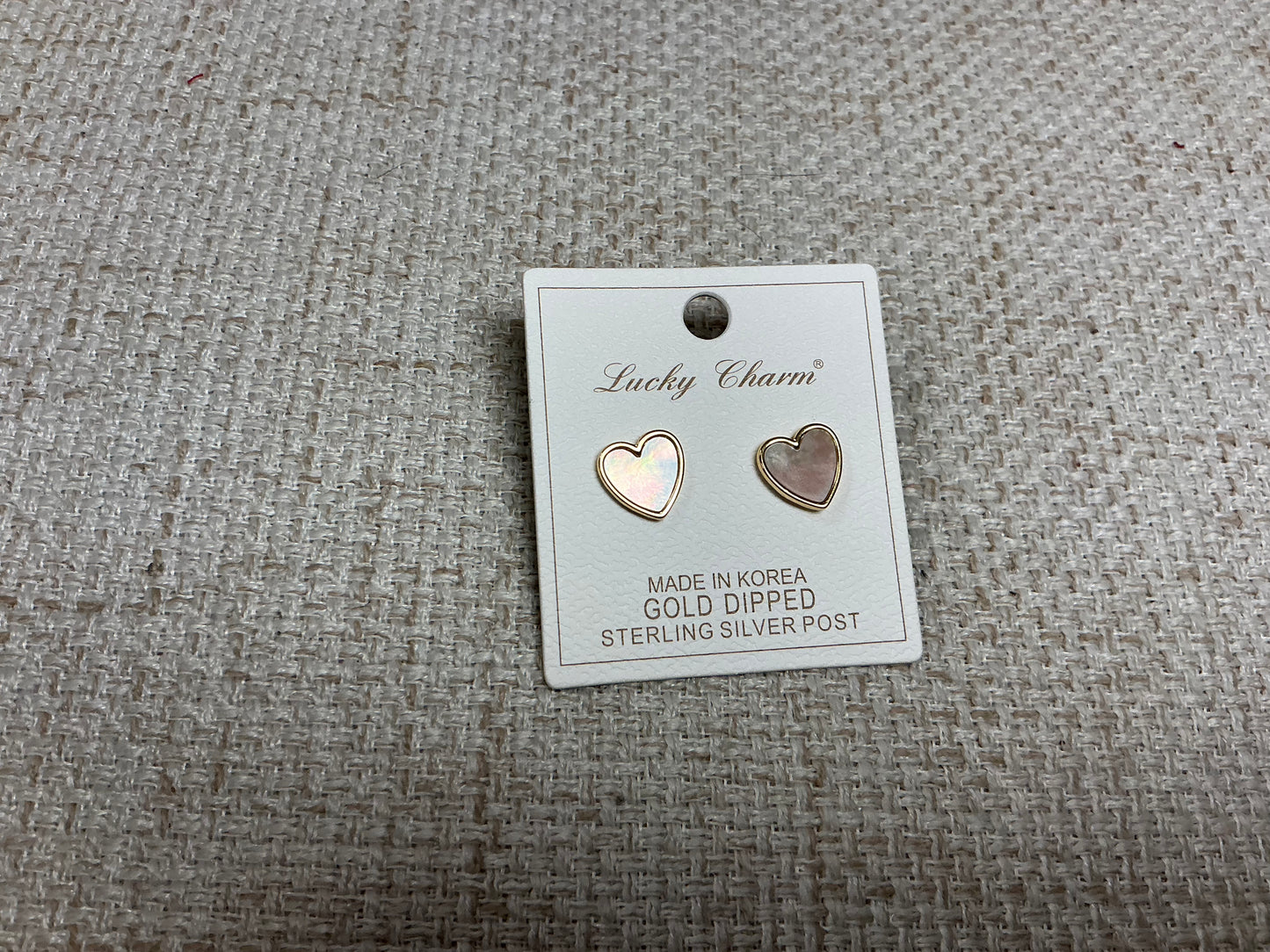 Opalite heart-shaped earrings by SM Style featuring translucent, glowing stones with silver hooks for elegant wear.