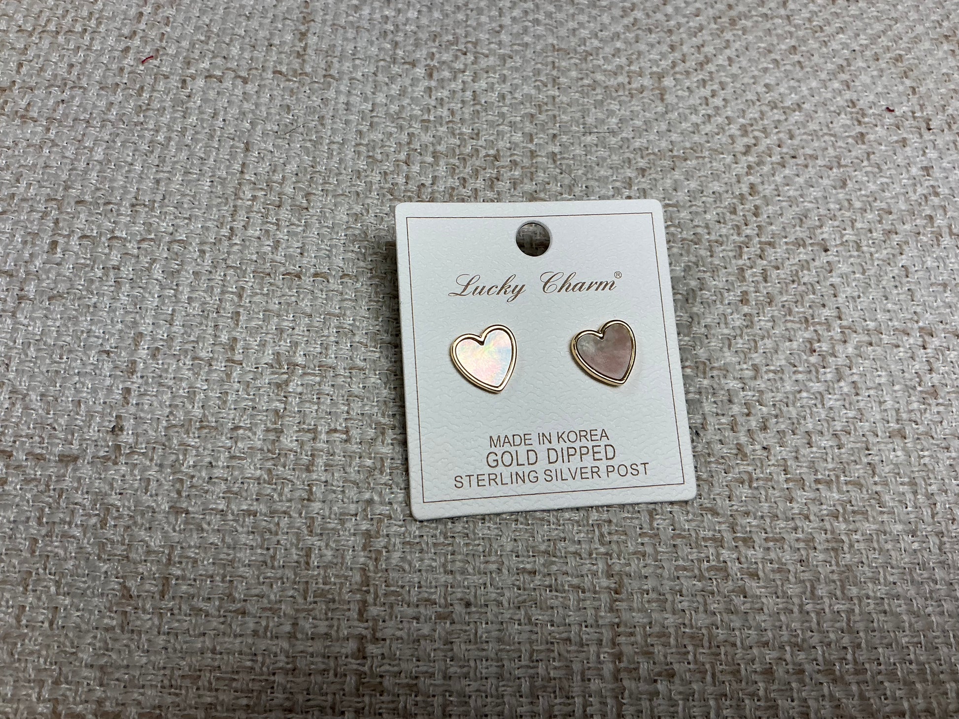 Opalite heart-shaped earrings by SM Style featuring translucent, glowing stones with silver hooks for elegant wear.