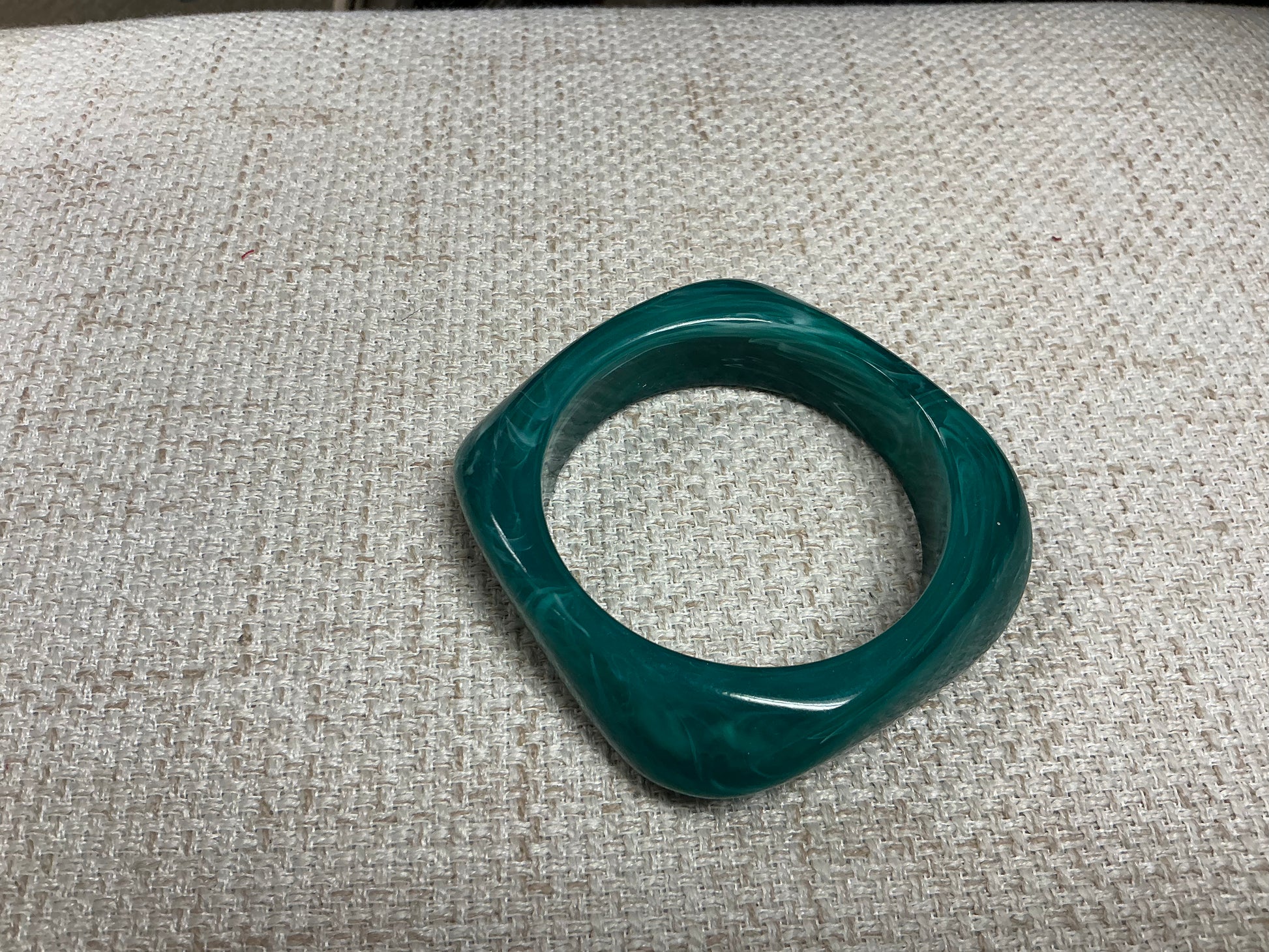 Green acrylic bracelet by SM Style, featuring smooth, vibrant beads in a stylish bracelet design.
