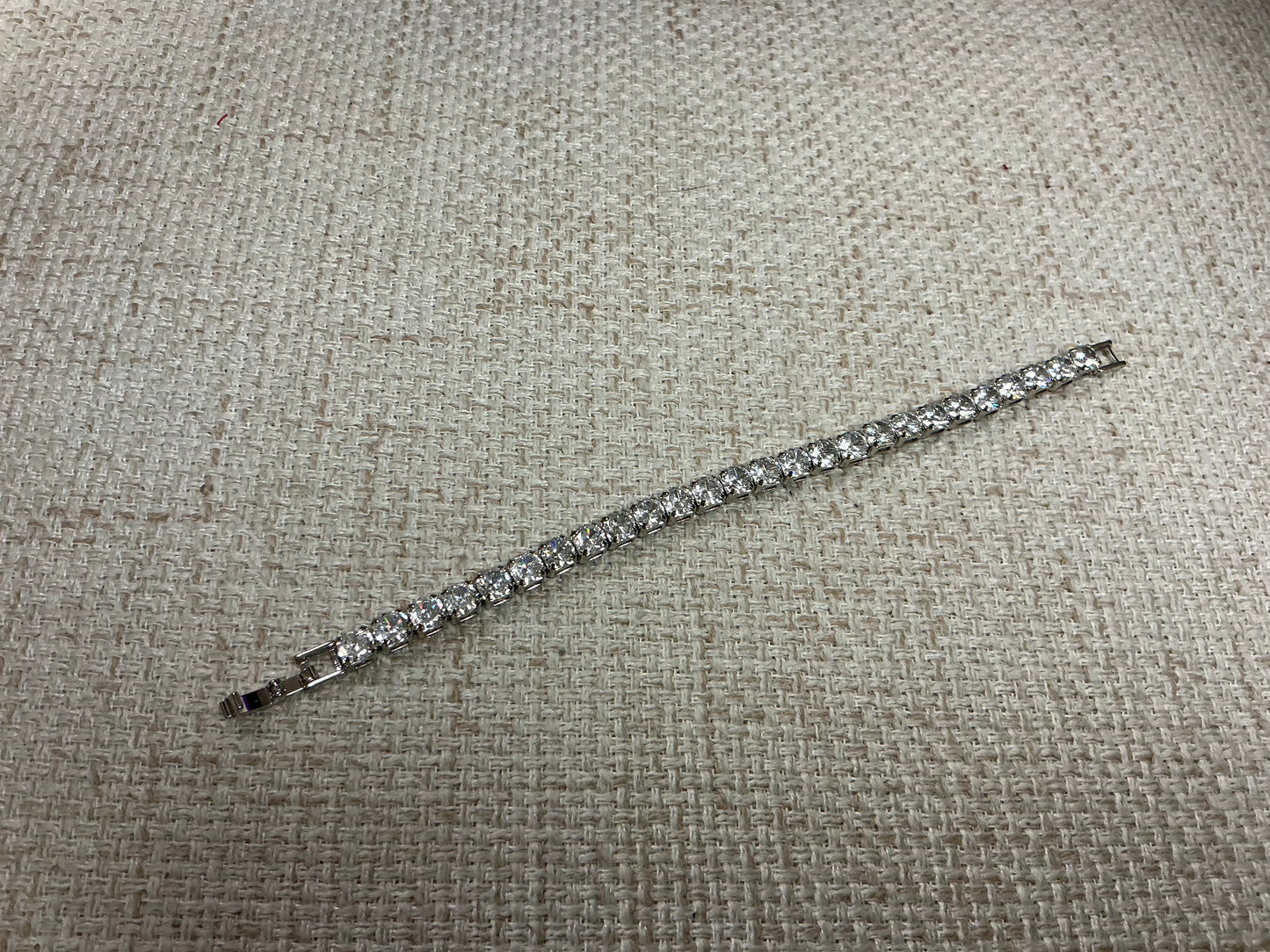 Soiree Line Tennis Anyone? bracelet featuring a delicate tennis-themed design and silver finish, ideal for tennis enthusiasts.