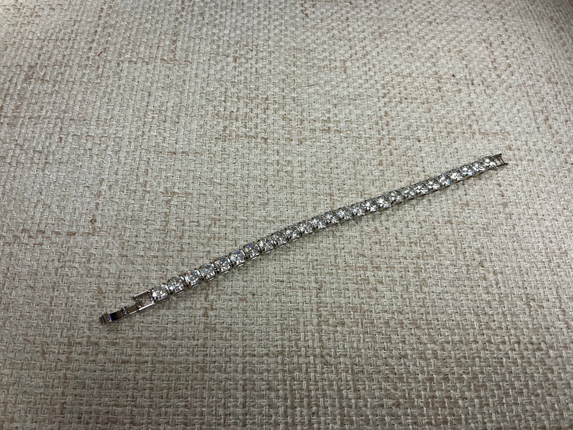 Soiree Line Tennis Anyone? bracelet featuring a delicate tennis-themed design and silver finish, ideal for tennis enthusiasts.