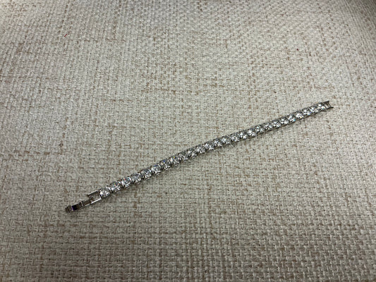 Soiree Line Tennis Anyone? bracelet featuring a delicate tennis-themed design and silver finish, ideal for tennis enthusiasts.
