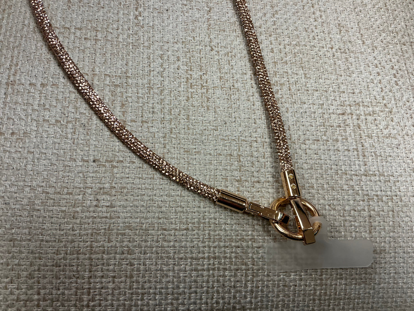 Glittery phone chain strap by Sunrise USA Trading featuring sparkling, decorative accessories for smartphones.