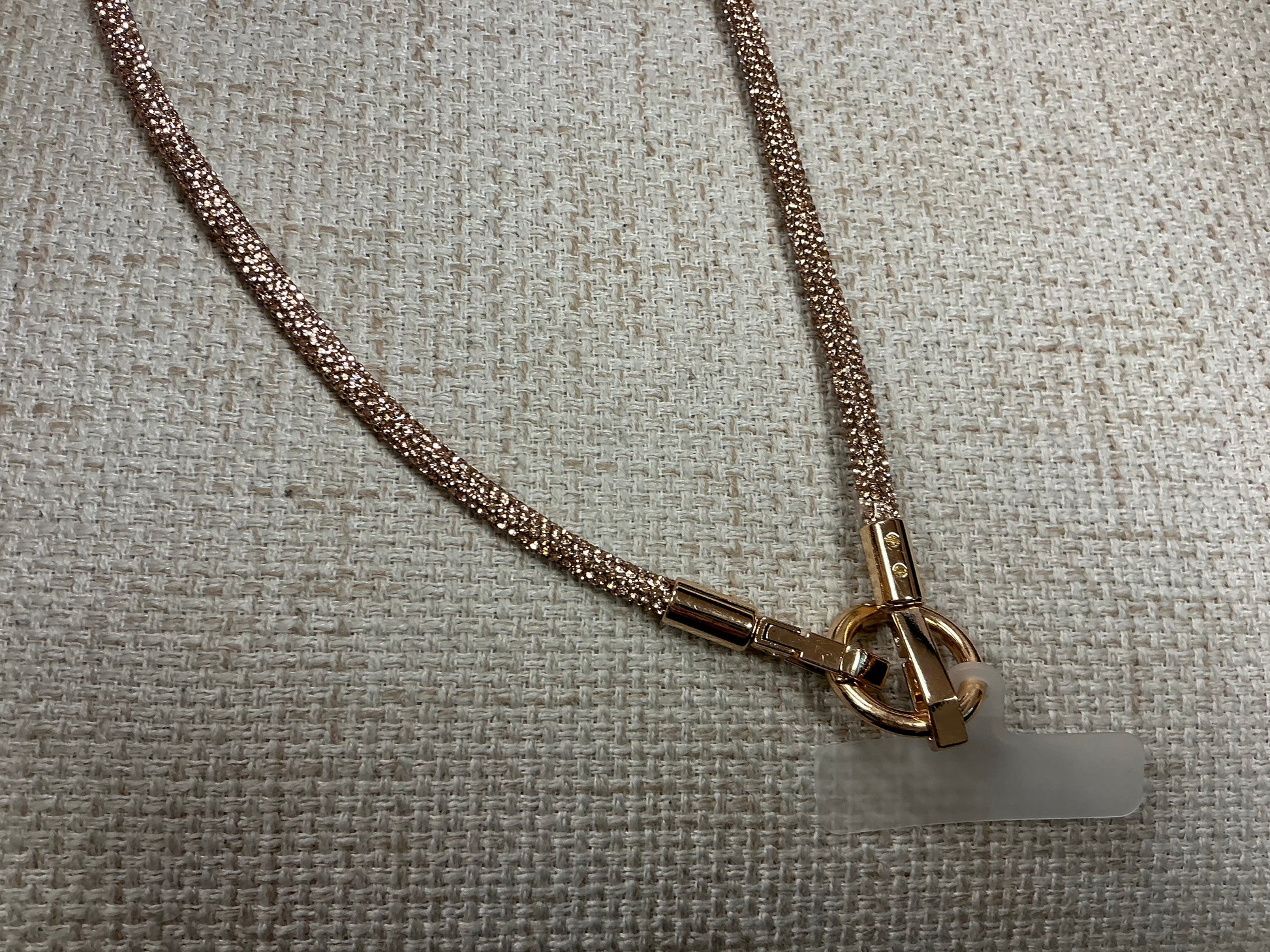 Glittery phone chain strap by Sunrise USA Trading featuring sparkling, decorative accessories for smartphones.