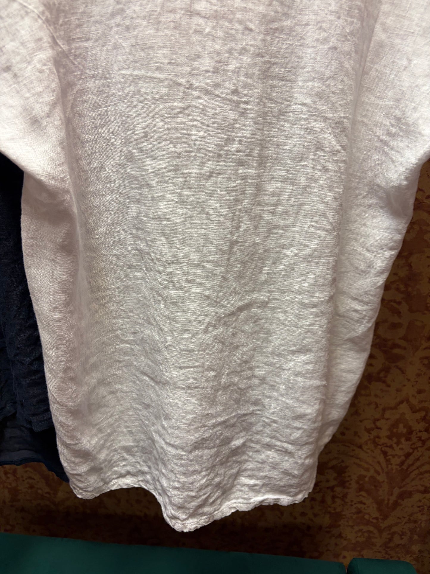 Camille & Co. ruffle linen top with short sleeves and delicate ruffle details, ideal for casual or summer outfits.