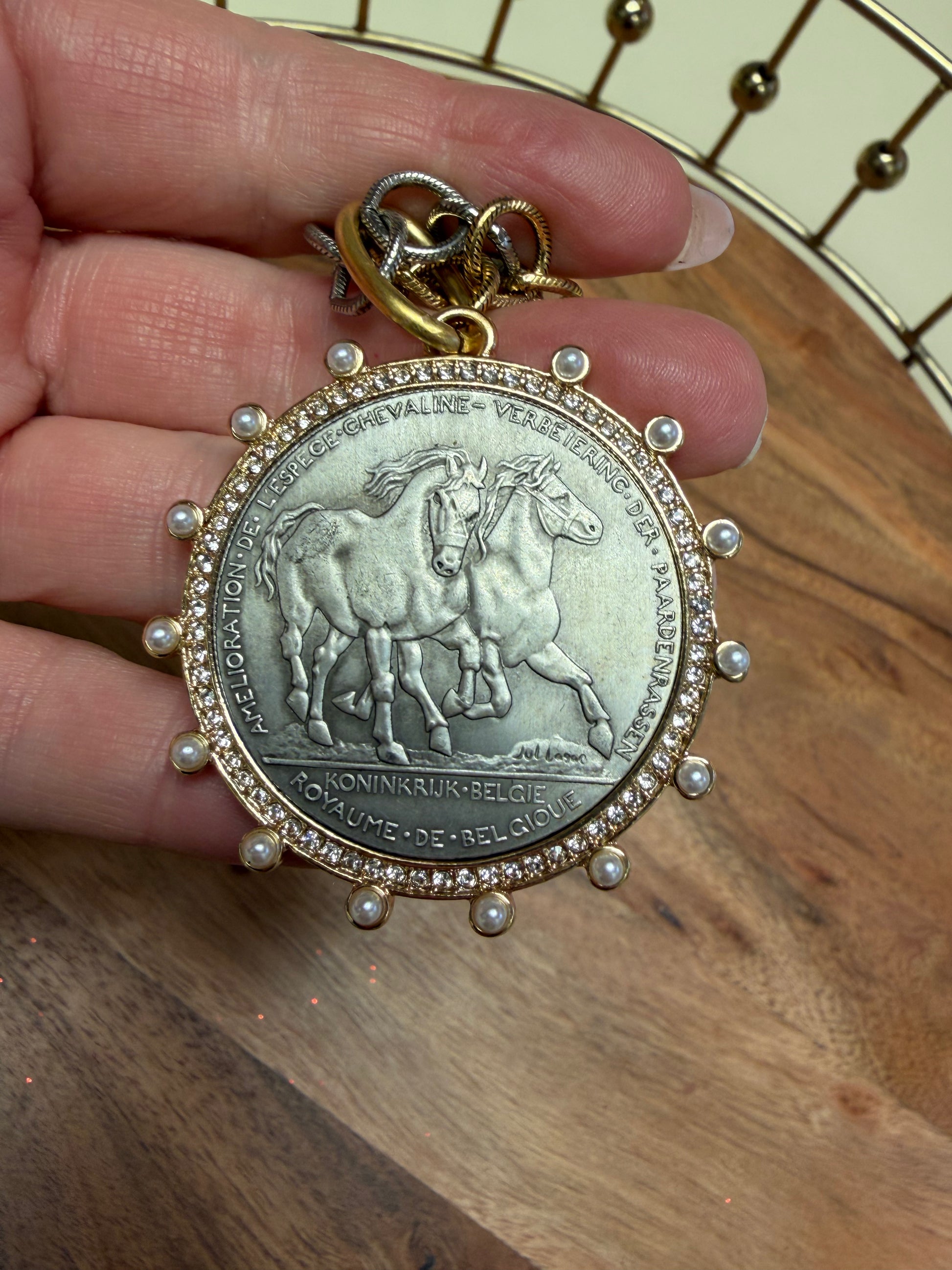 Lula 'n' Lee Hainaut 1906 necklace featuring intricate metalwork and vintage-inspired design, displayed on a neutral background.