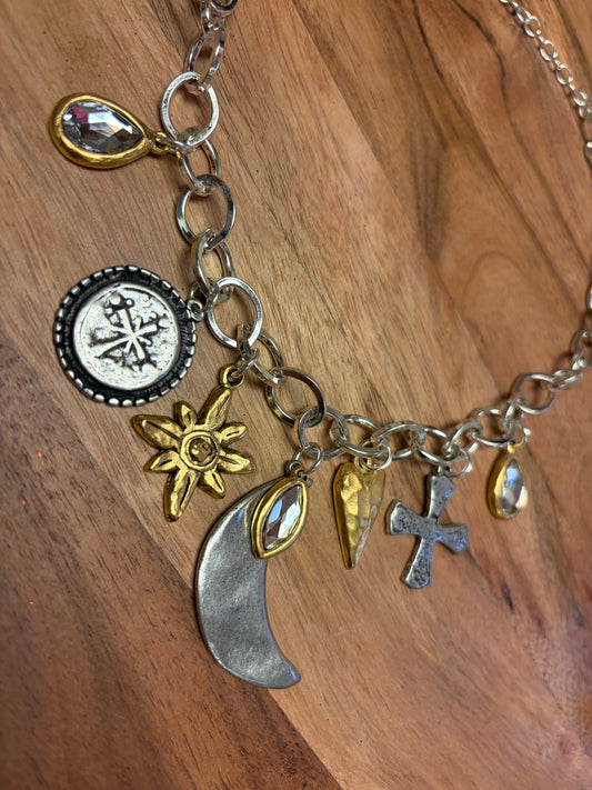 Lula 'n' Lee Charmed by the Moon necklace featuring a silver moon pendant on a delicate chain.