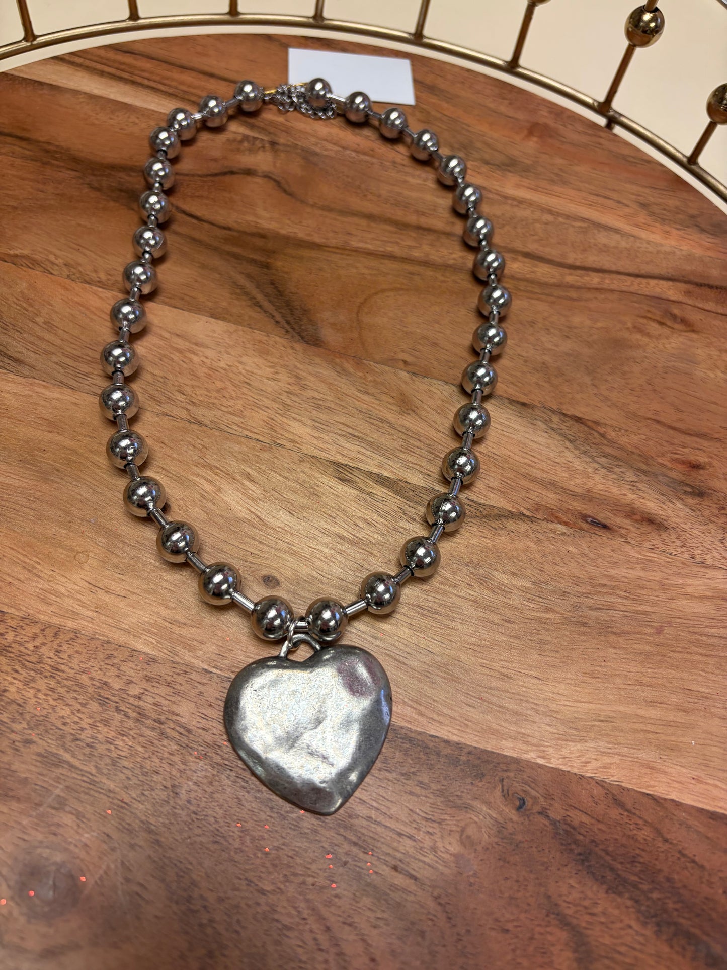 Lula 'n' Lee Ball Chain Heart Necklace featuring a delicate chain and heart pendant, elegant jewelry accessory.