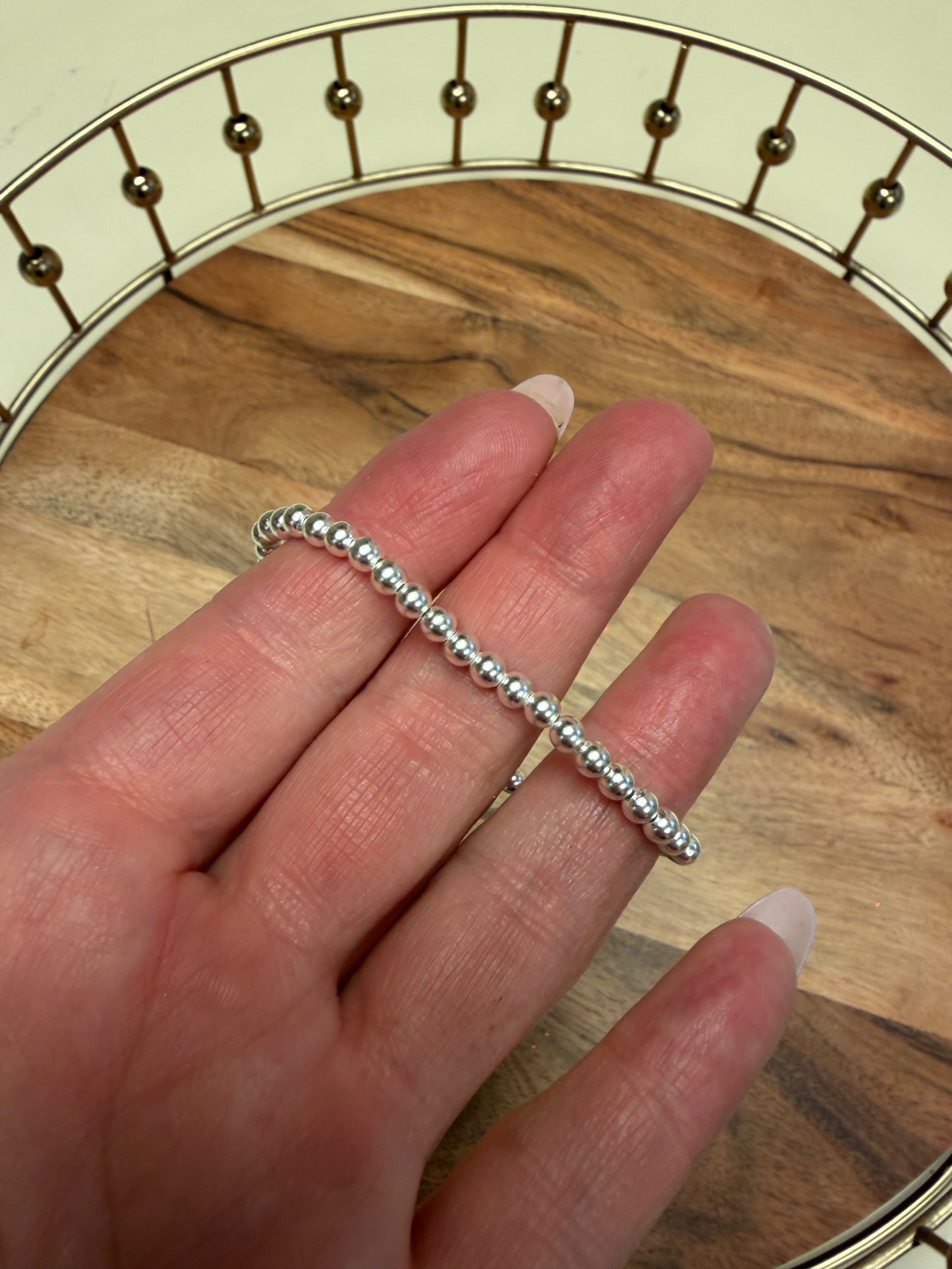 Sterling silver beaded bracelet by Lula 'n' Lee with round silver beads and adjustable clasp, displayed on a neutral background.