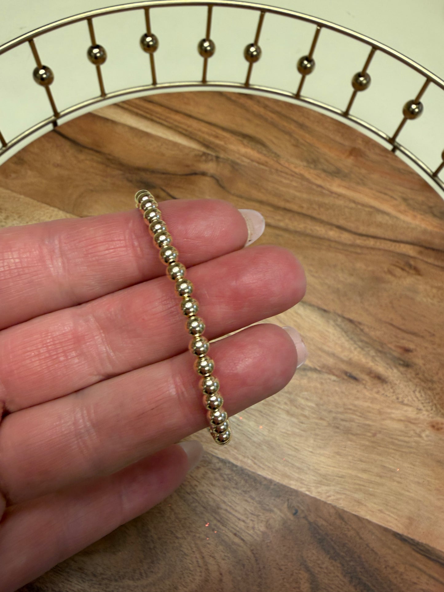 Gold filled beaded bracelet by Lula 'n' Lee featuring small round beads and an adjustable clasp.