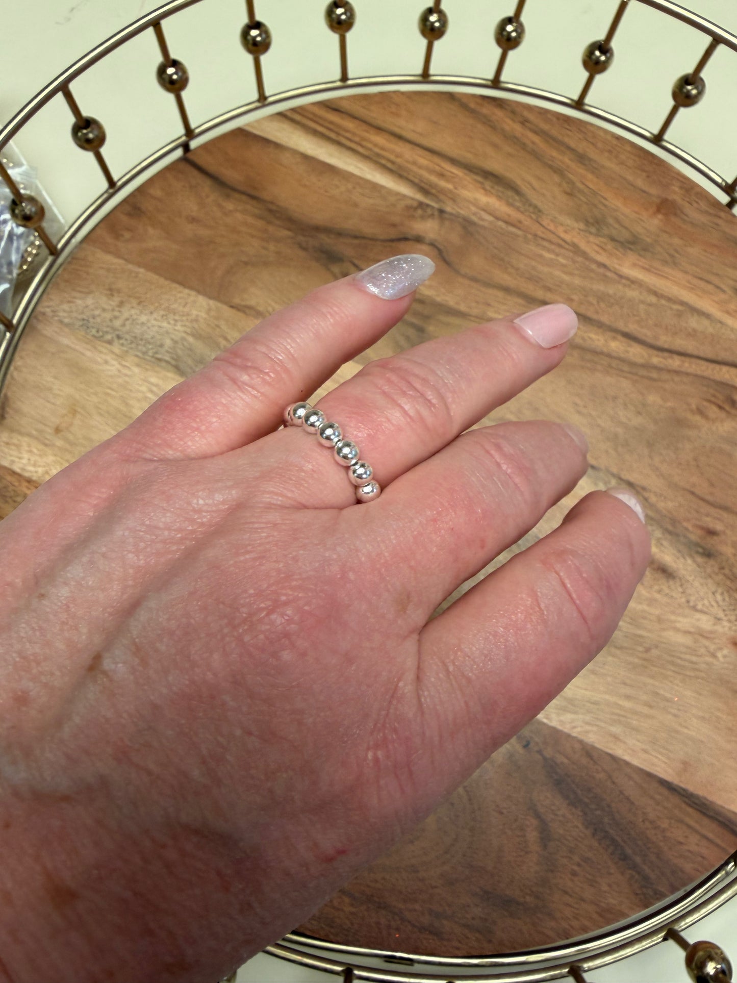 Sterling silver beaded ring by Lula 'n' Lee featuring a textured beaded design on a shiny band.