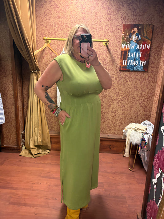 Entro Matcha Dress featuring a flowy, green fabric with a fitted waist and elegant design, perfect for casual or semi-formal wear.