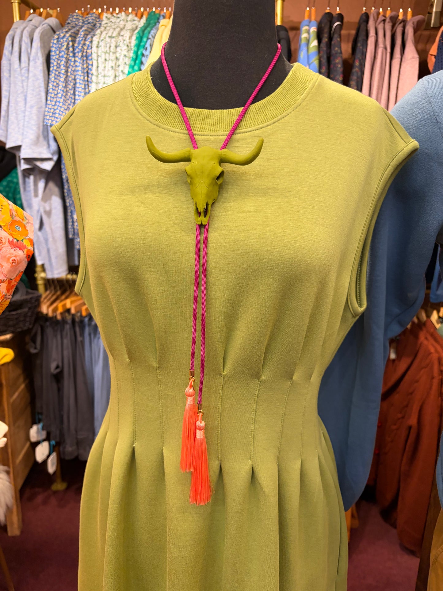 Entro Matcha Dress showing a stylish green dress with a fitted waist and flowy skirt, perfect for casual or semi-formal wear.