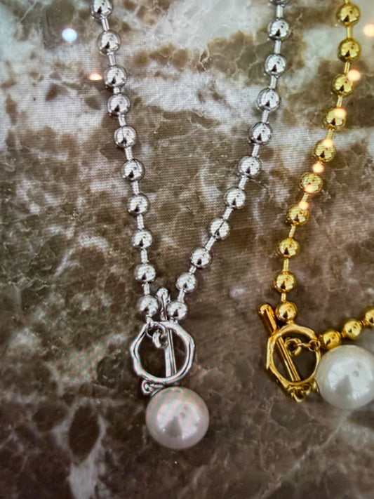 Elegant Danielle Necklace by CHANSUTTPEARLS featuring delicate pearls and a silver clasp on a soft chain.
