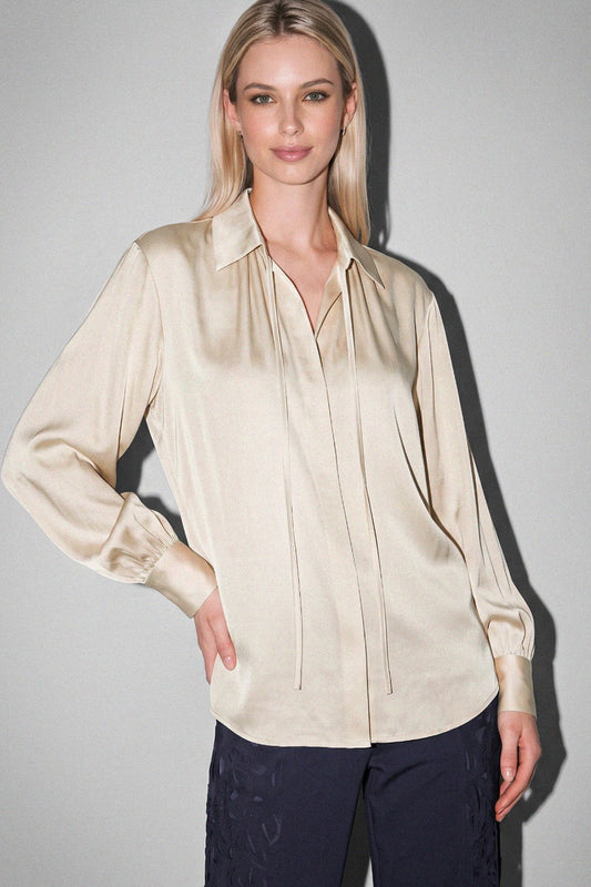 Ecru front tie silky blouse by Current Air, featuring a soft fabric and elegant design, displayed on a hanger.