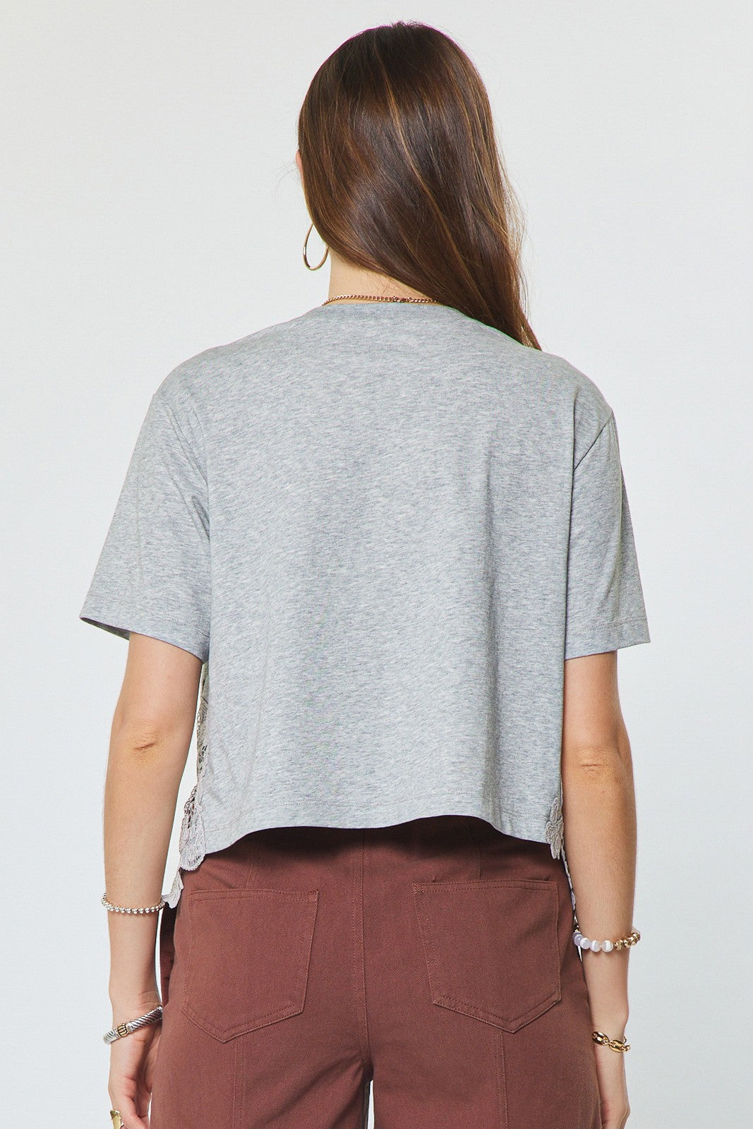 Current Air Lacy Tee tops in soft fabric with delicate lace details, shown on a neutral background.