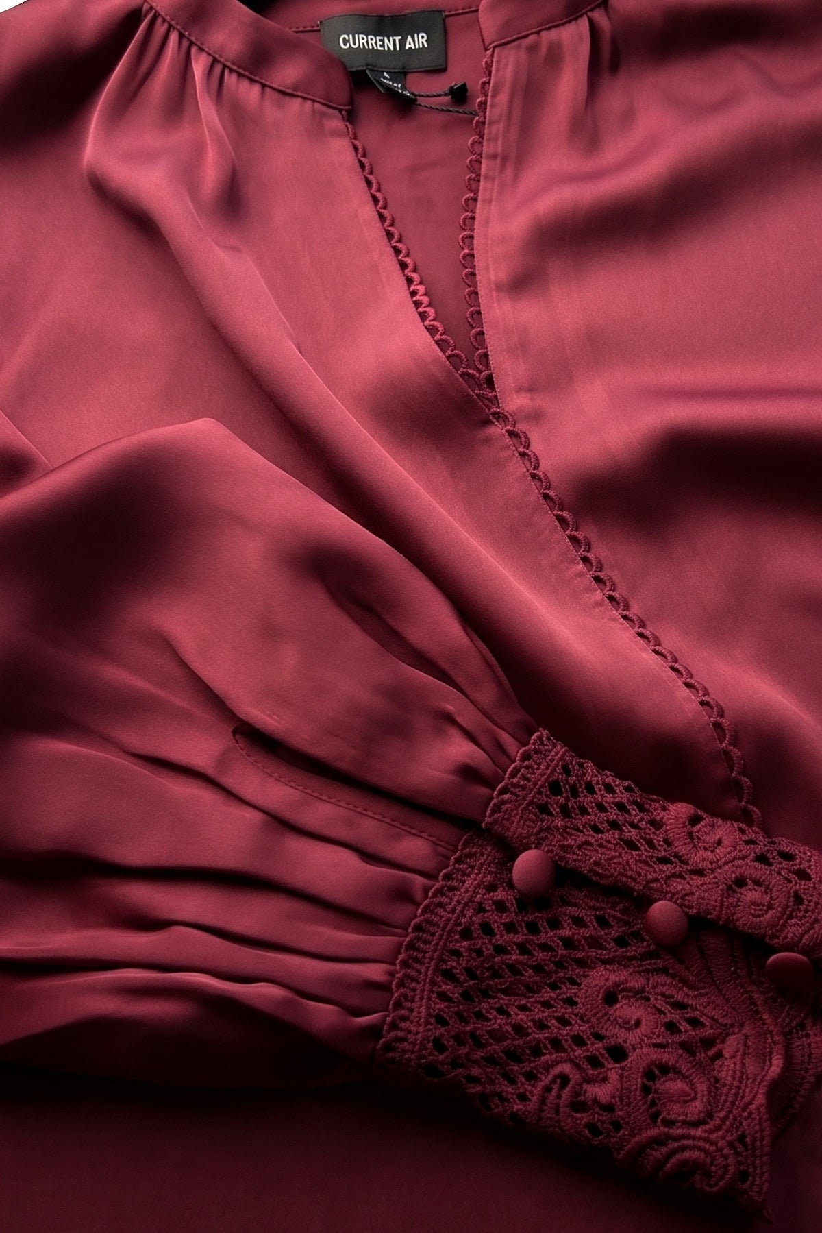Lace cuff V-neck blouse by Current Air, featuring delicate lace details and a stylish V-neck design.