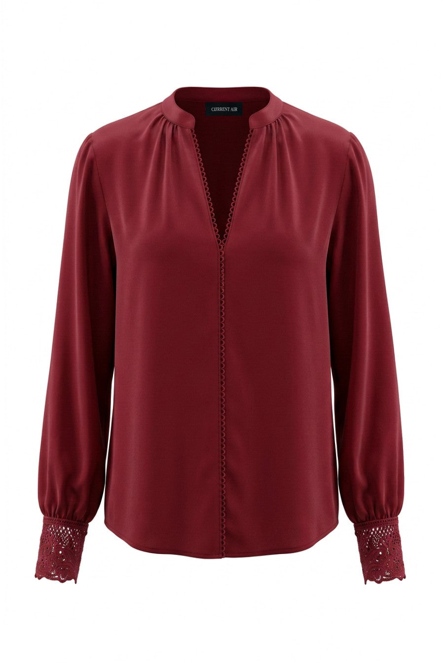 Current Air lace cuff V-neck blouse featuring delicate lace details and a stylish V neckline, shown on a model.