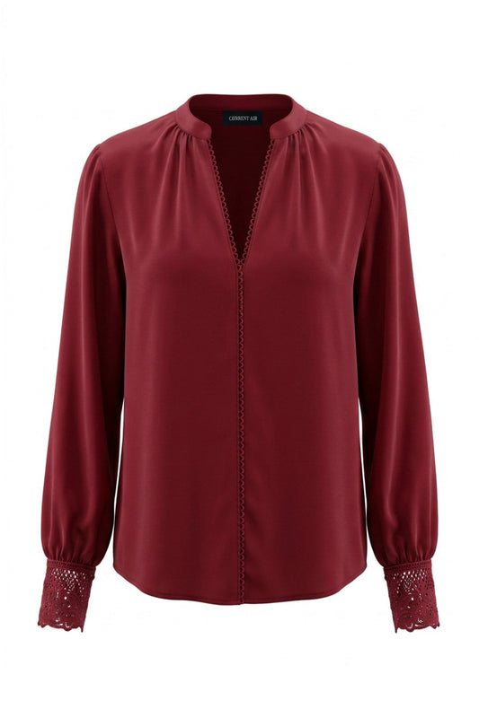 Current Air lace cuff V-neck blouse featuring delicate lace details and a stylish V neckline, shown on a model.