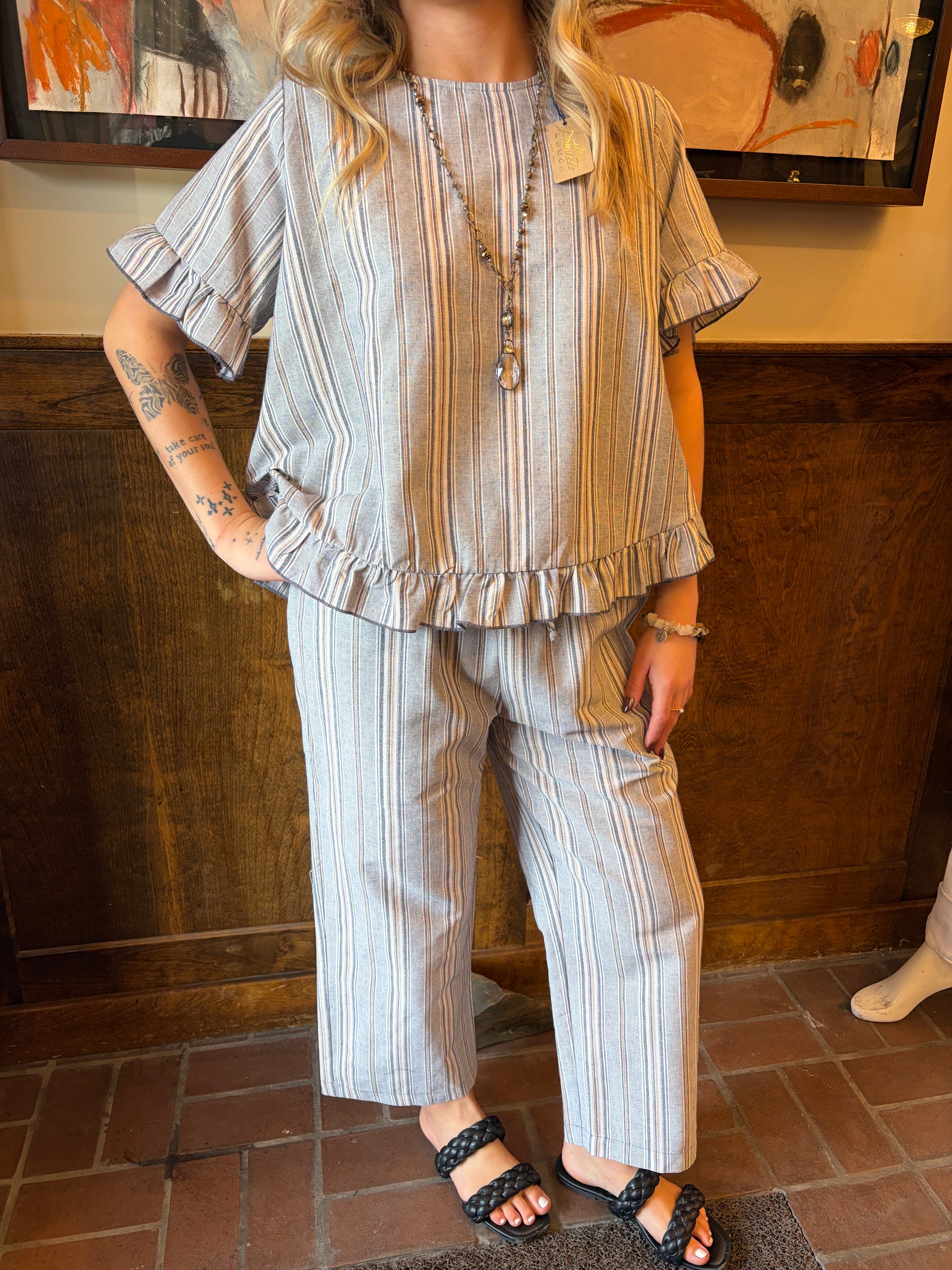 Camille & Co. Earn Your Stripes pants featuring bold striped pattern, relaxed fit, and stylish bottom wear for casual or chic looks.