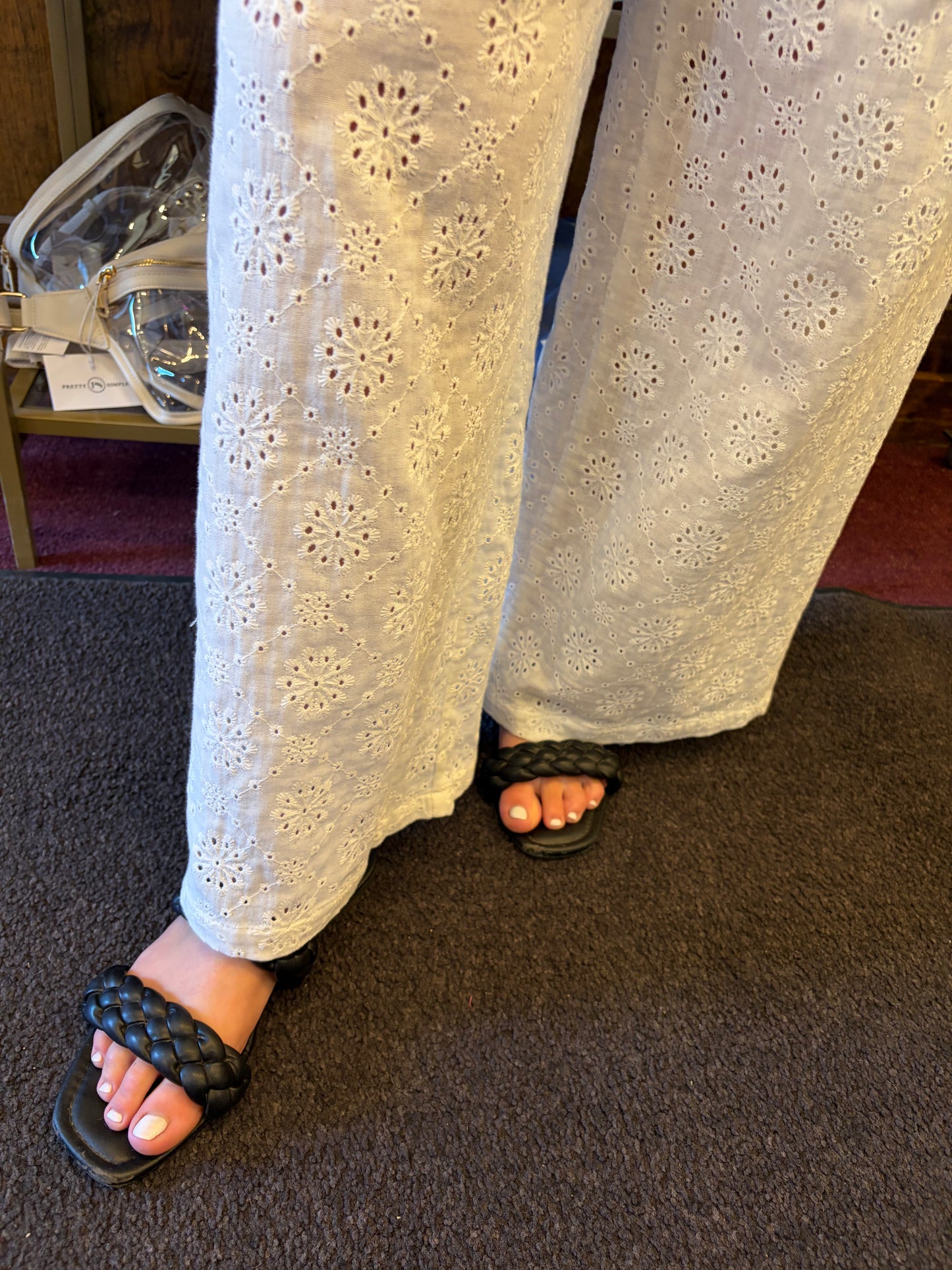 Simply Southern eyelet lace pants displayed on a model, showcasing lightweight, stylish bottoms with intricate lace details.
