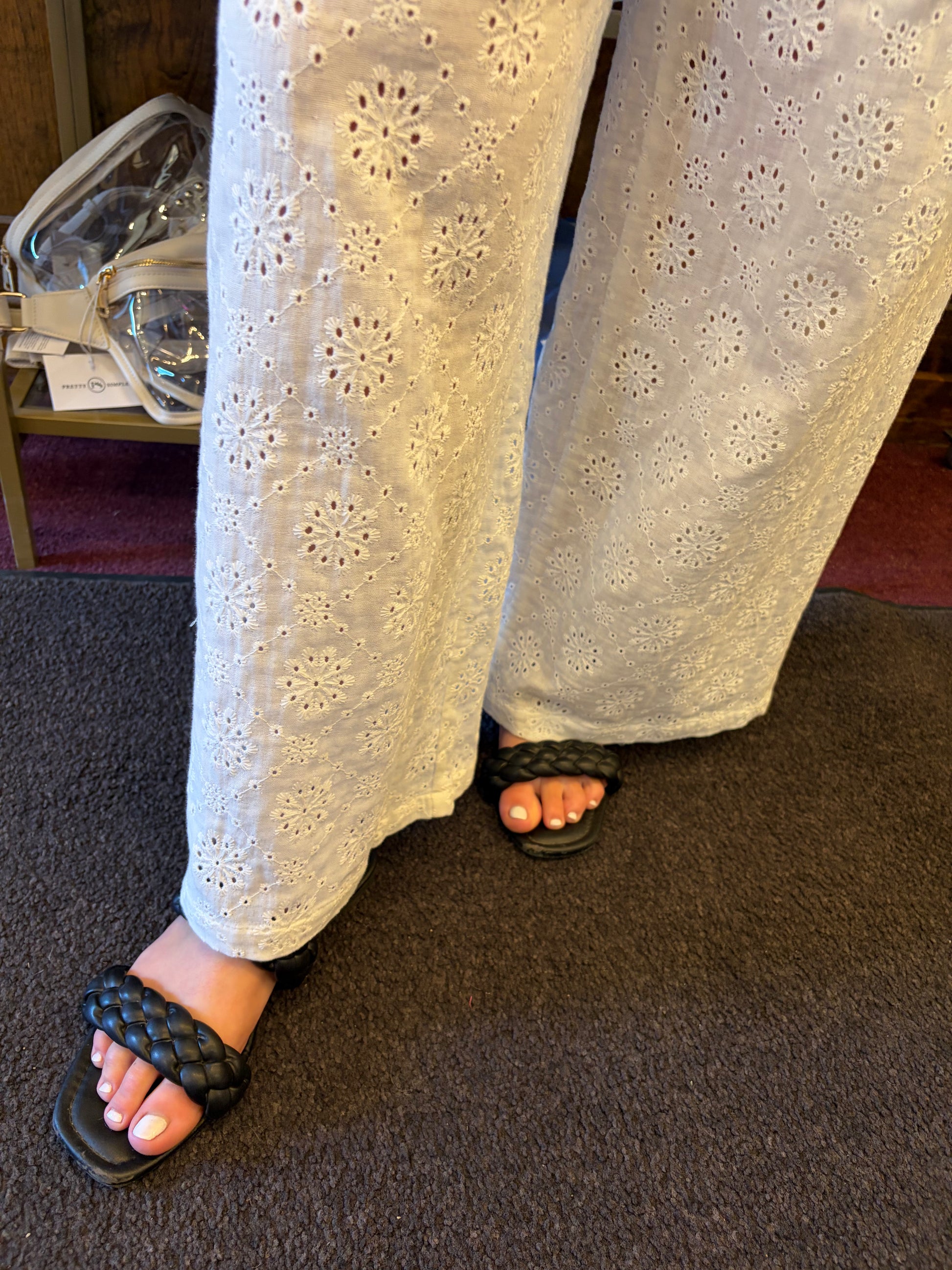 Simply Southern eyelet lace pants displayed on a model, showcasing lightweight, stylish bottoms with intricate lace details.