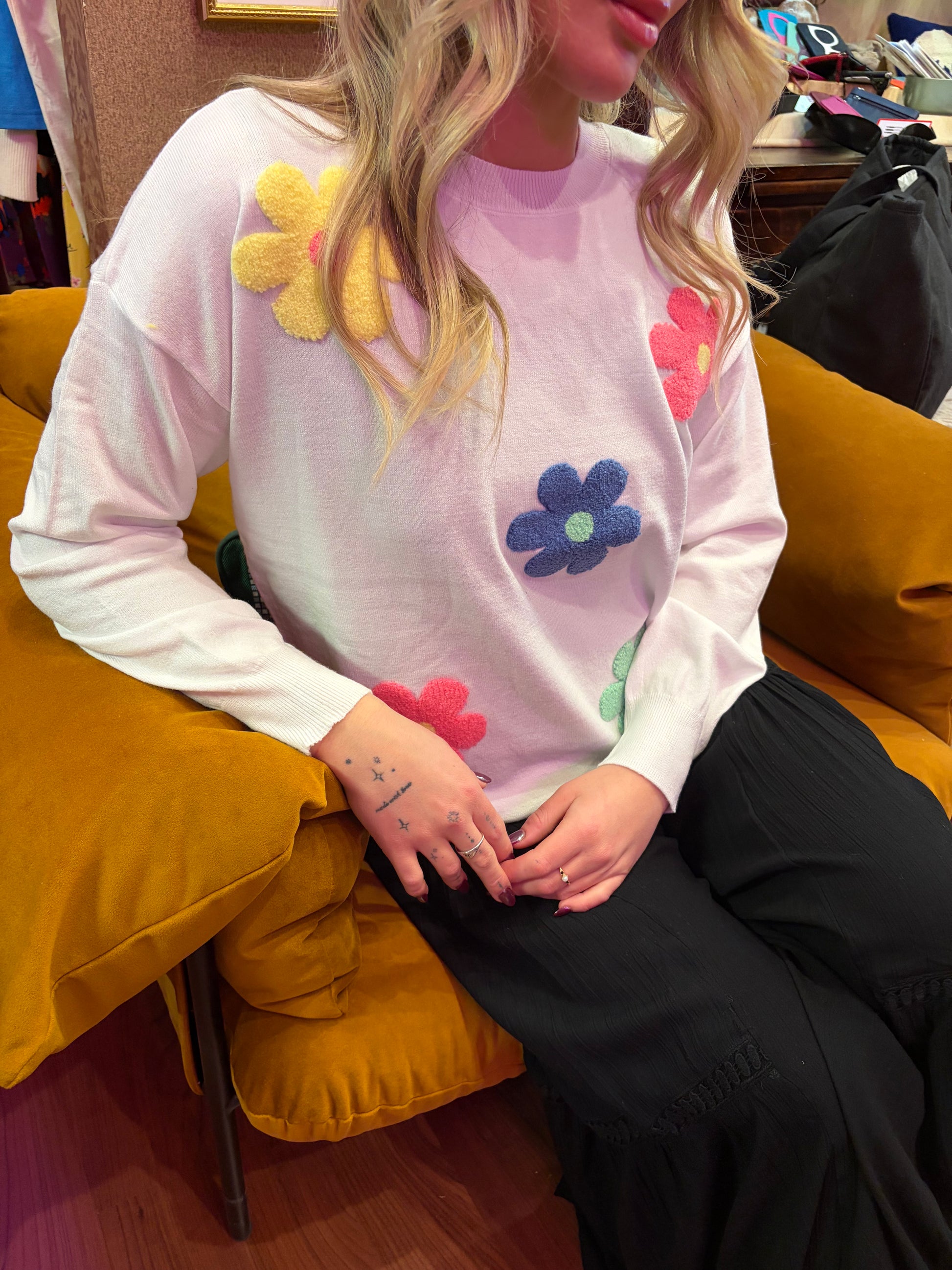 Camille & Co. Spring Flowers Sweater featuring colorful floral knit pattern on soft fabric, perfect for spring wear.