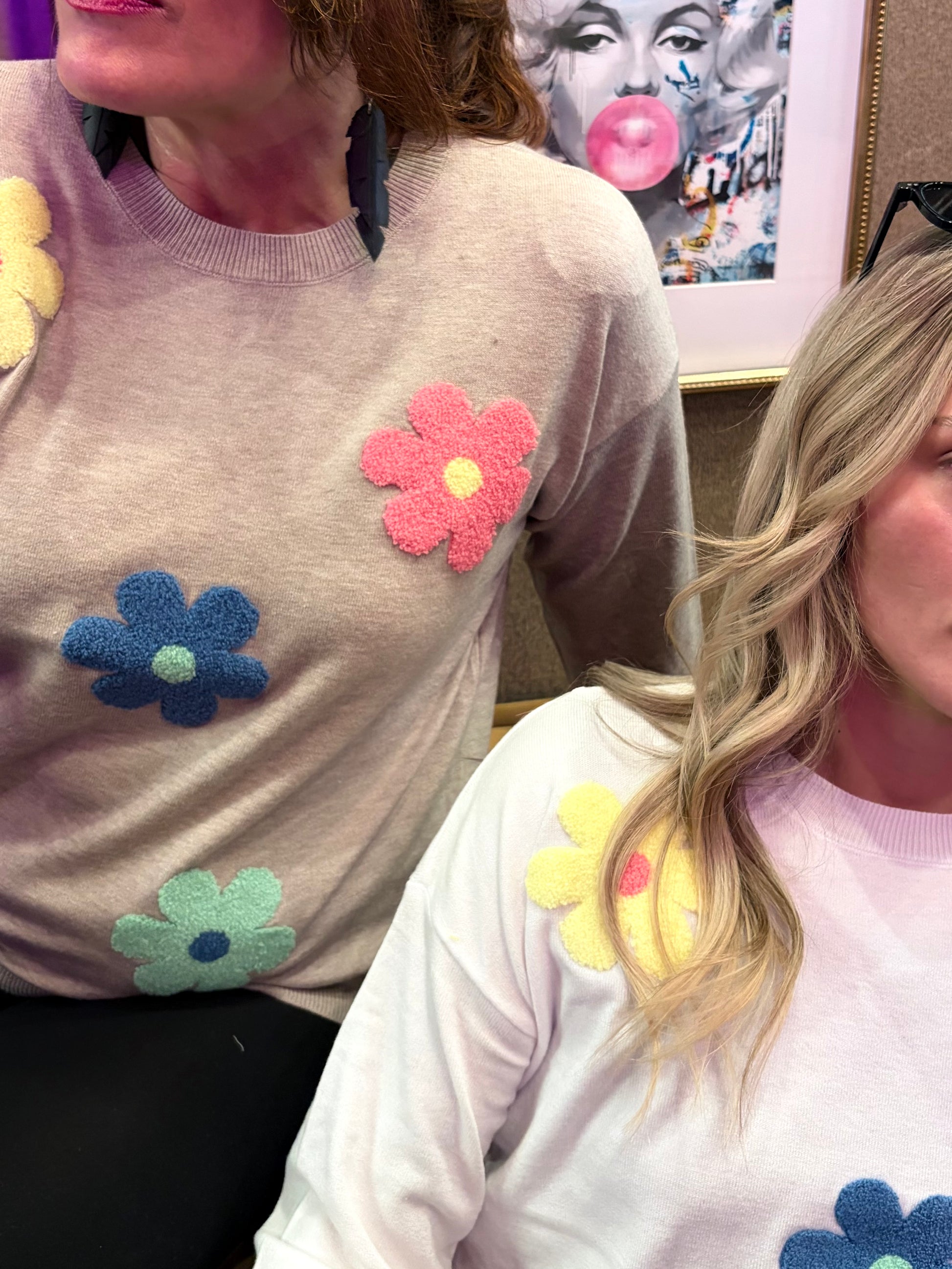 Camille & Co. Spring Flowers sweater featuring a colorful floral pattern on soft fabric, ideal for casual spring wear.