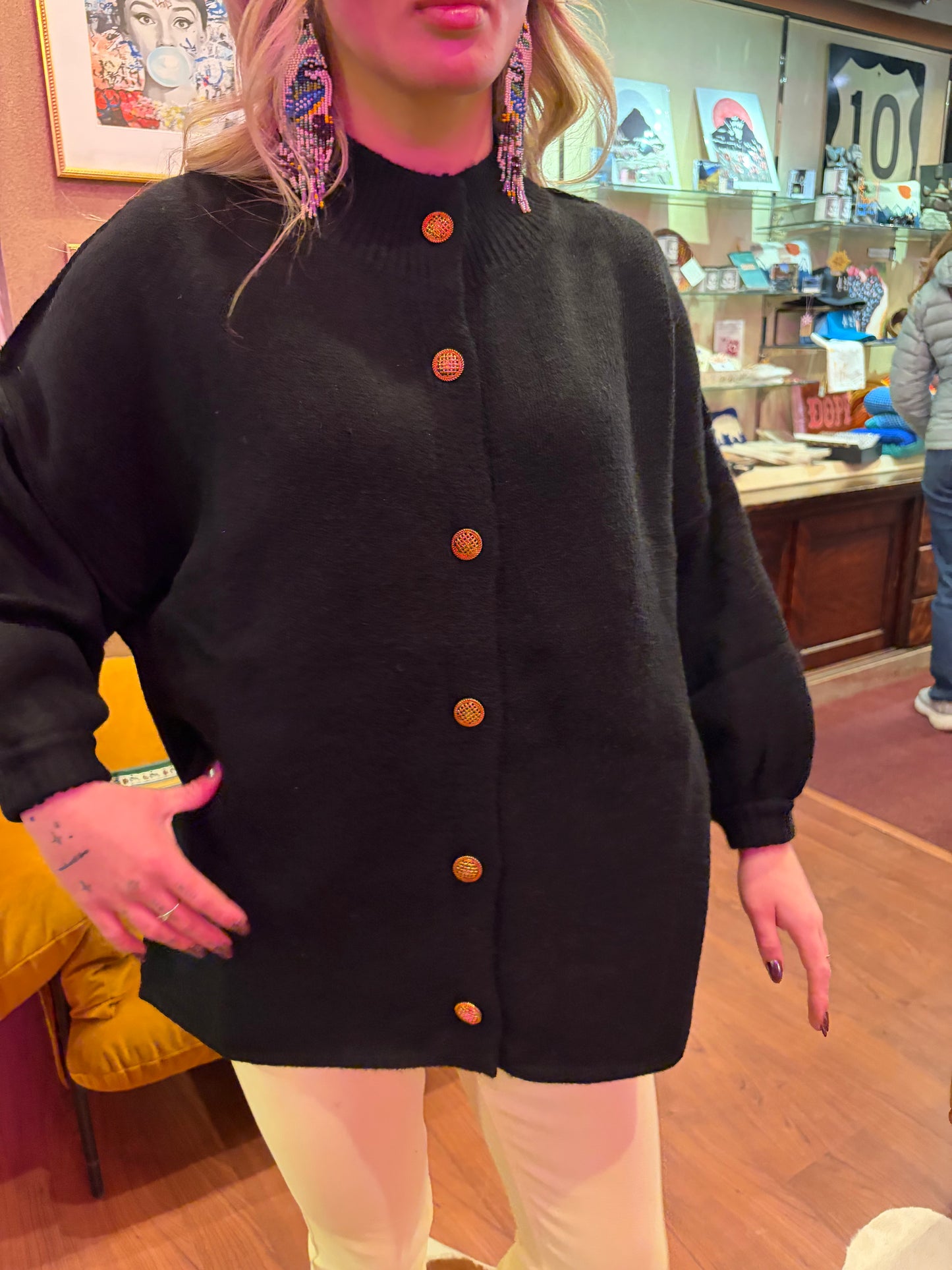 Camille & Co. Doleman sweater showing a cozy knit design in soft neutral tones, front view with long sleeves.