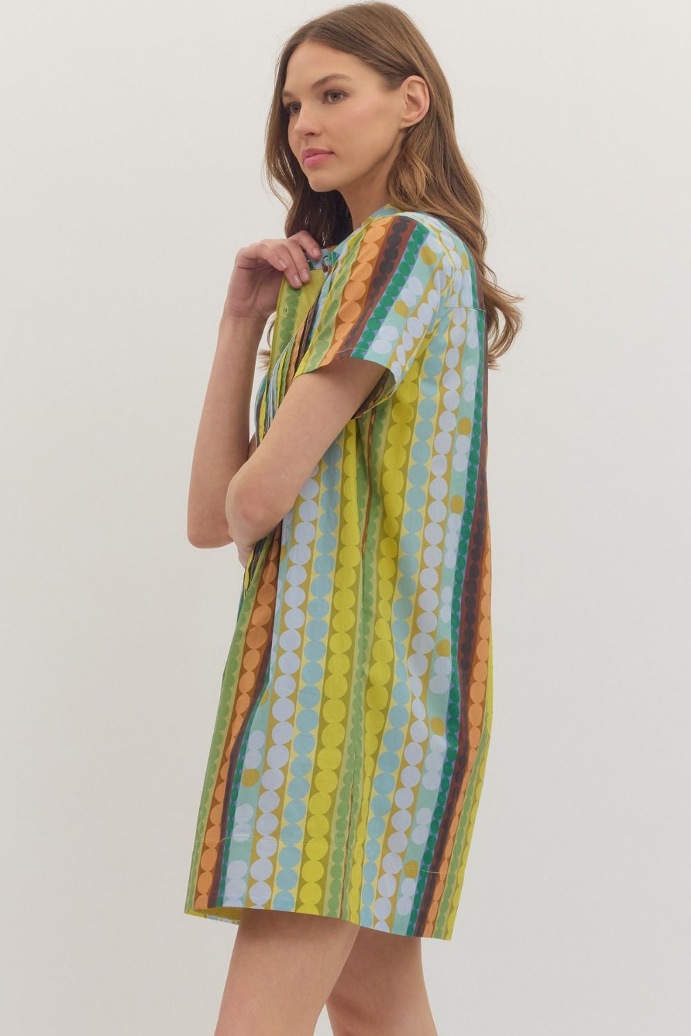 Entro Mod Dots Dress shown from the side, featuring a stylish polka dot pattern and comfortable fit.