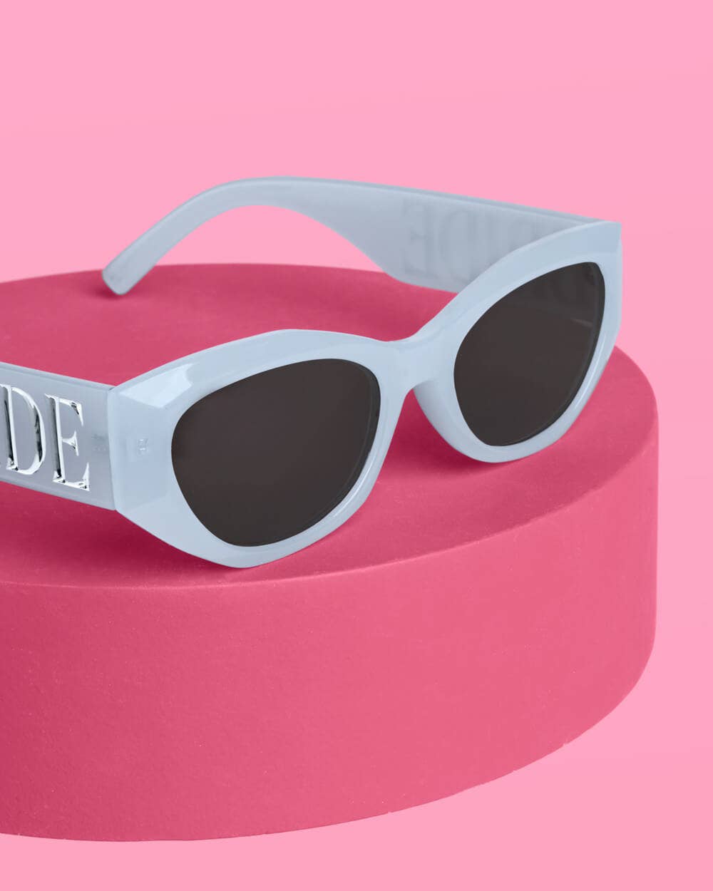 Blue sunglasses with bride embossed design by xo, Fetti, perfect for bachelorette parties and bridal gifts.