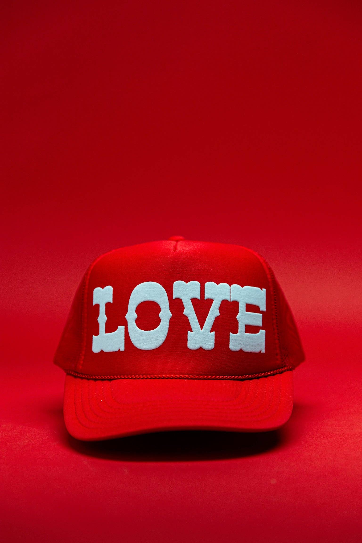 Ascot + Hart Big Love Trucker hat featuring a structured cap with a front logo patch and adjustable snapback closure.