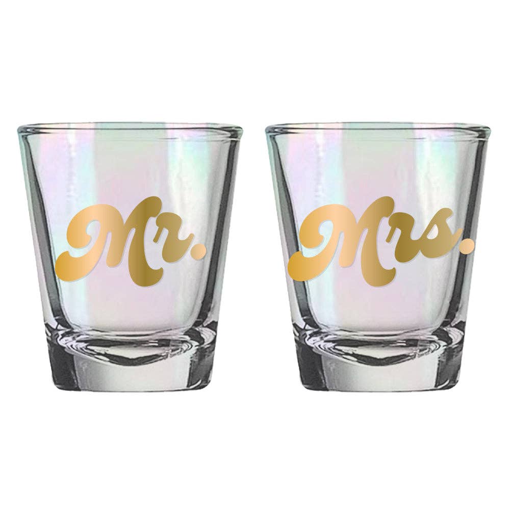 Set of two wedding shot glasses with "Mr." and "Mrs." lettering by Soiree Sisters, featuring elegant design and clear glass.