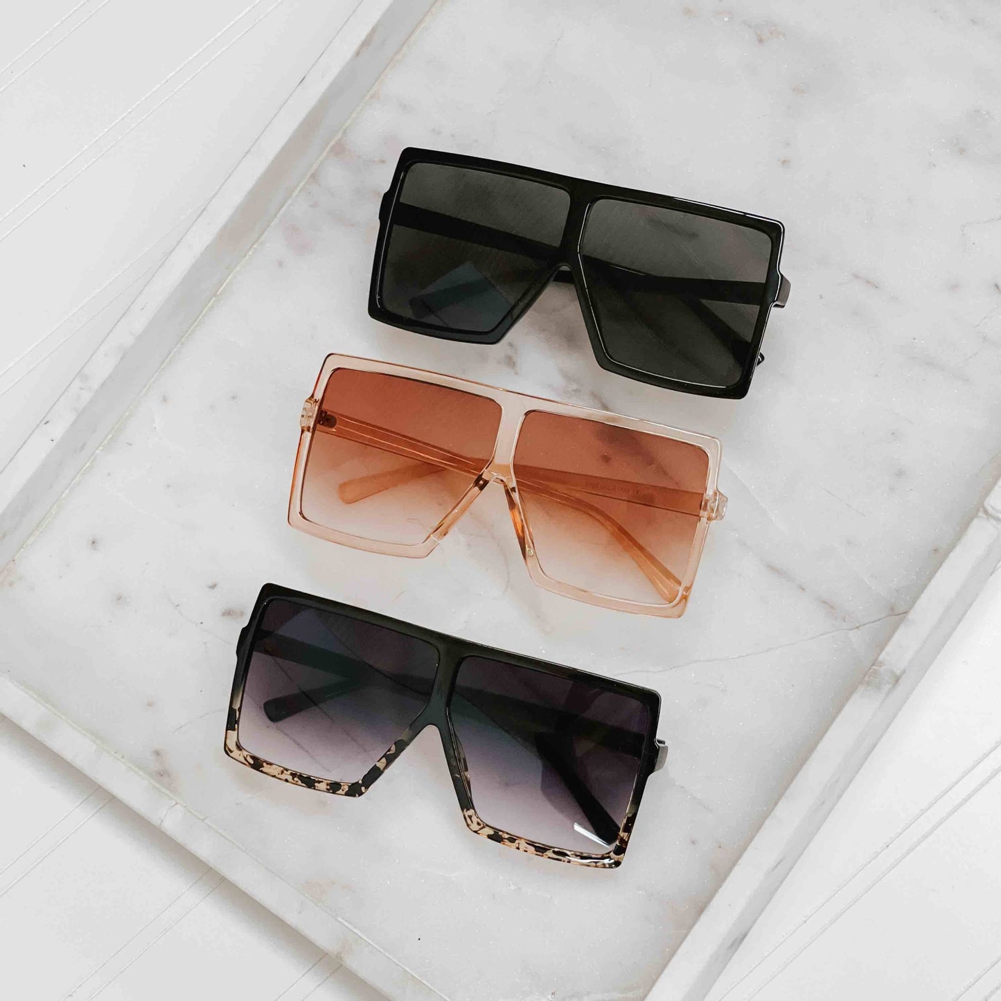 Pretty Simple Beverly oversized sunglasses with dark tinted lenses and thick black frames, stylish and trendy eyewear.