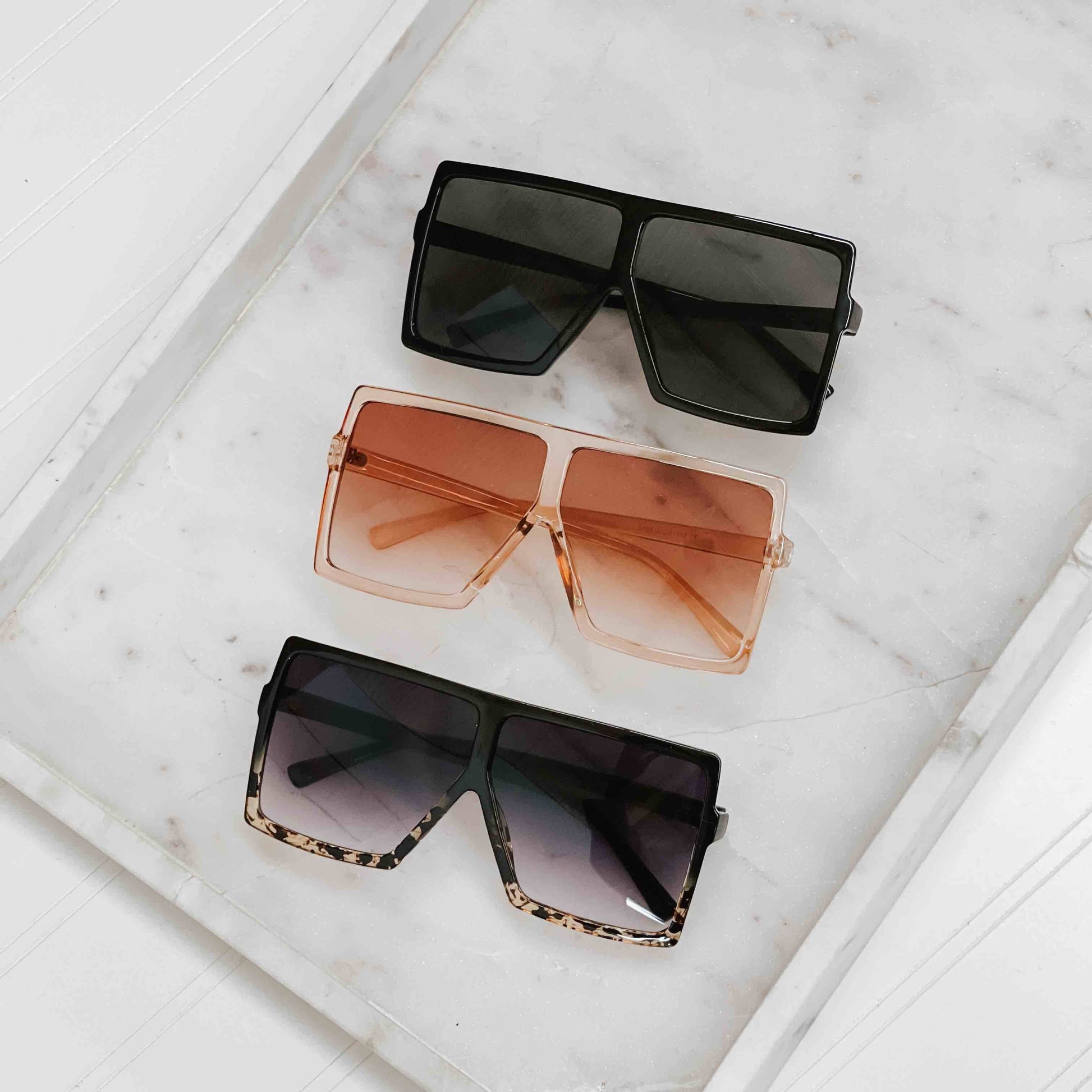 Pretty Simple Beverly oversized sunglasses with dark tinted lenses and thick black frames, stylish and trendy eyewear.