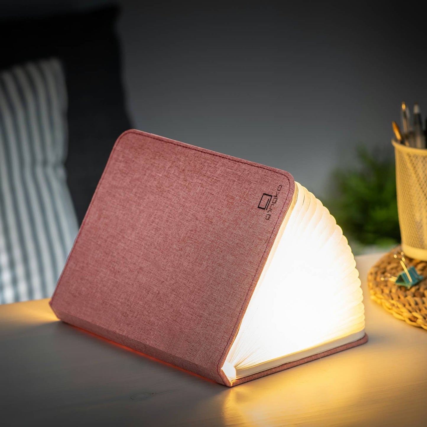Gingko Design linen fabric smart book light lamp with soft fabric cover and adjustable LED light for reading and ambiance.