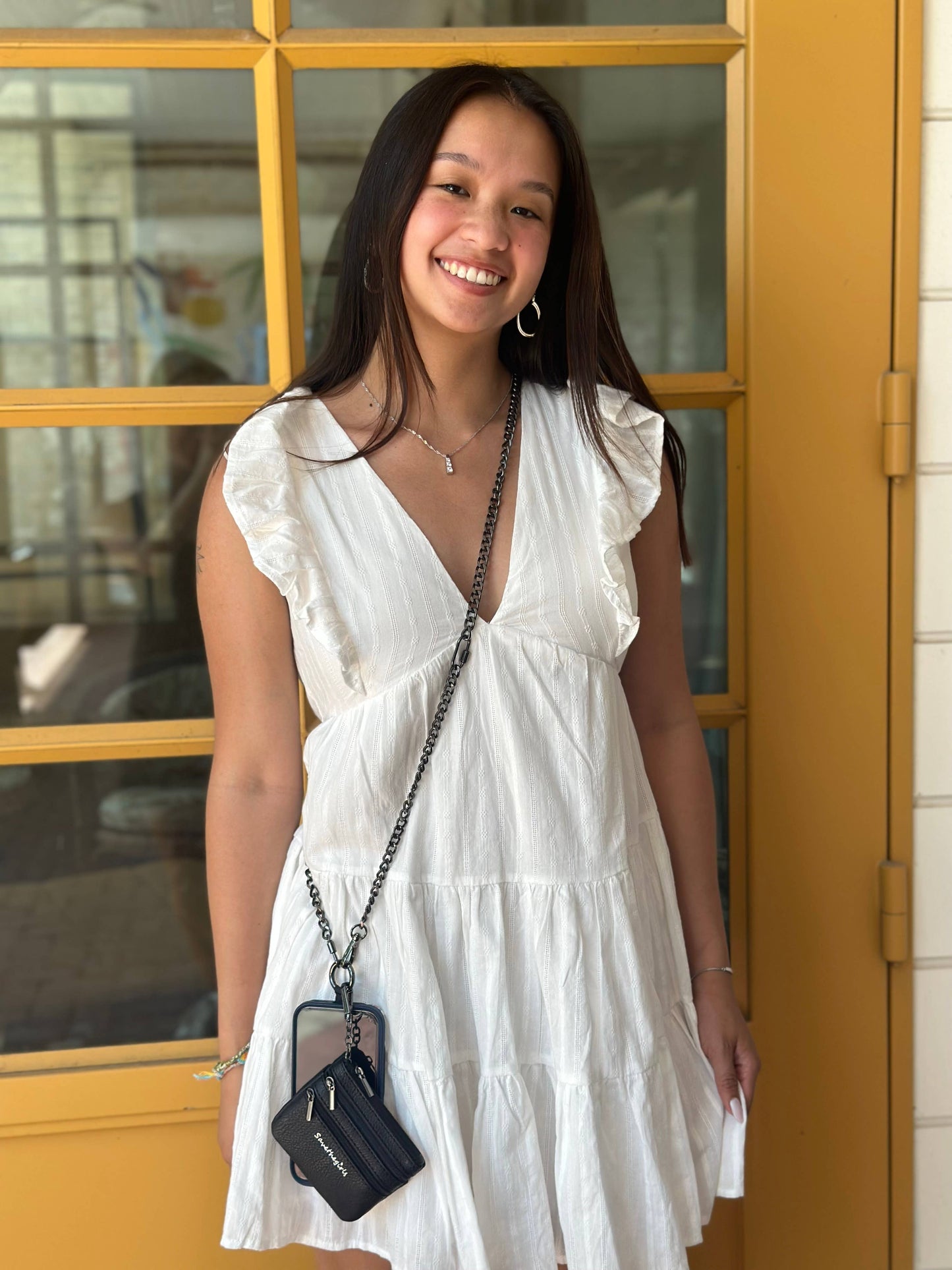 Save The Girls Clip & Go crossbody phone strap with clip attachment and stylish design for hands-free convenience.
