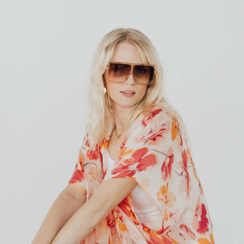 Pretty Simple Beverly oversized sunglasses with dark tinted lenses and thick black frames on a neutral background.
