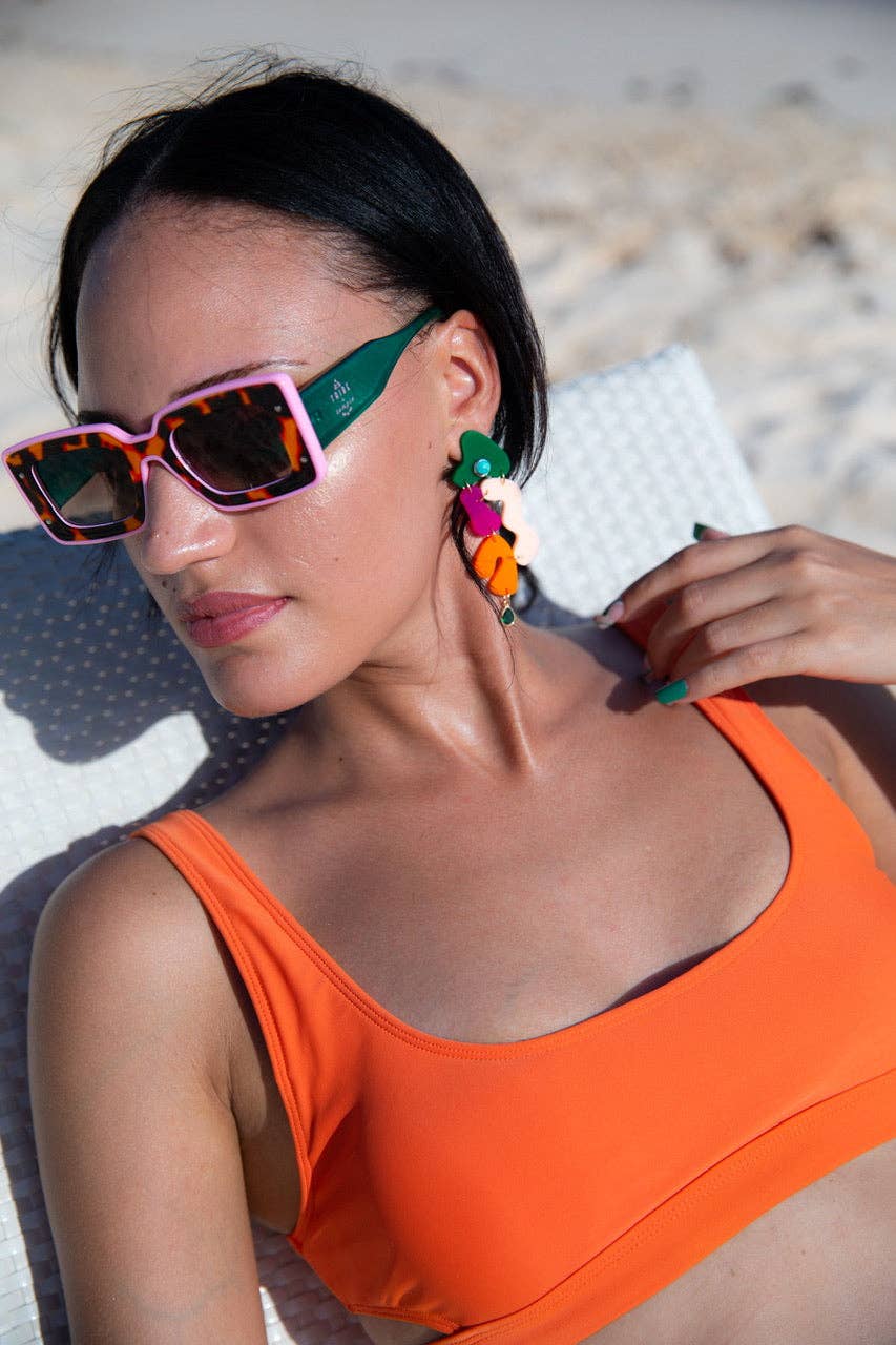 Tribe + Temple Deco sunglasses featuring bold geometric frames and tinted lenses, stylish accessory for sunny days.