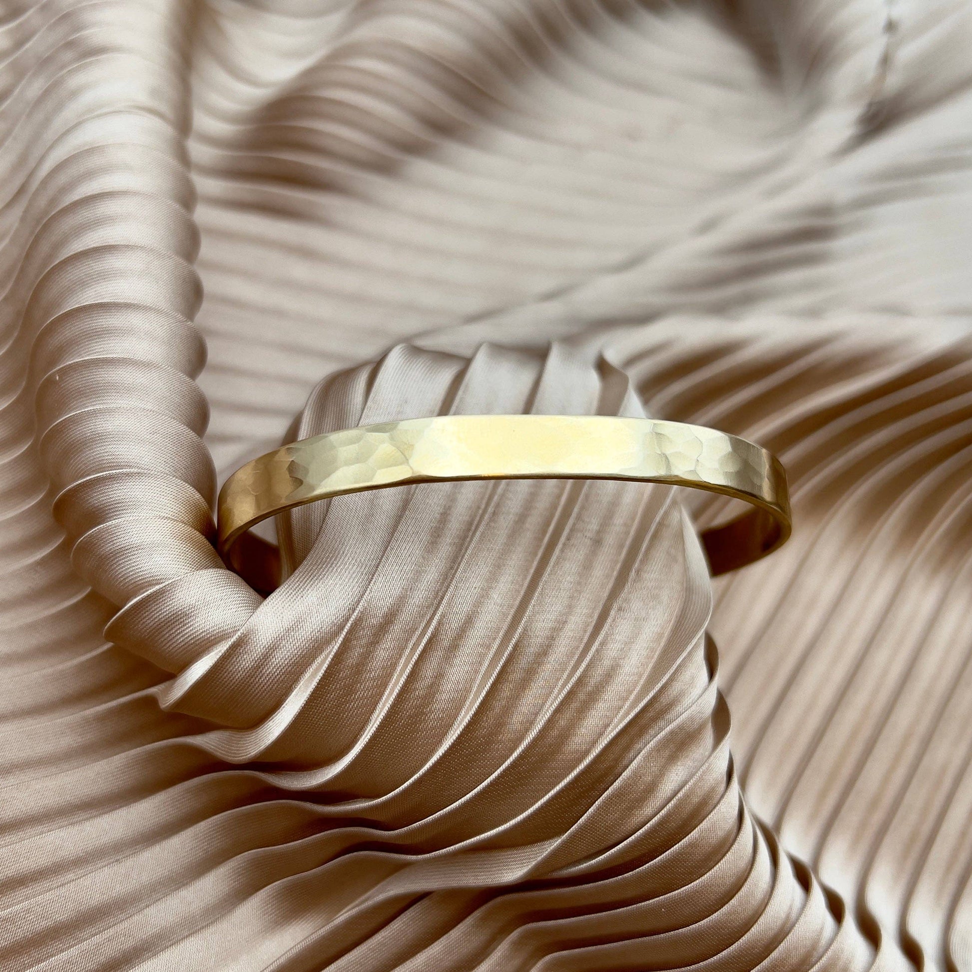 Handmade She-ra cuff bracelet by Fluff Hardware featuring intricate metalwork and bold, artistic design.