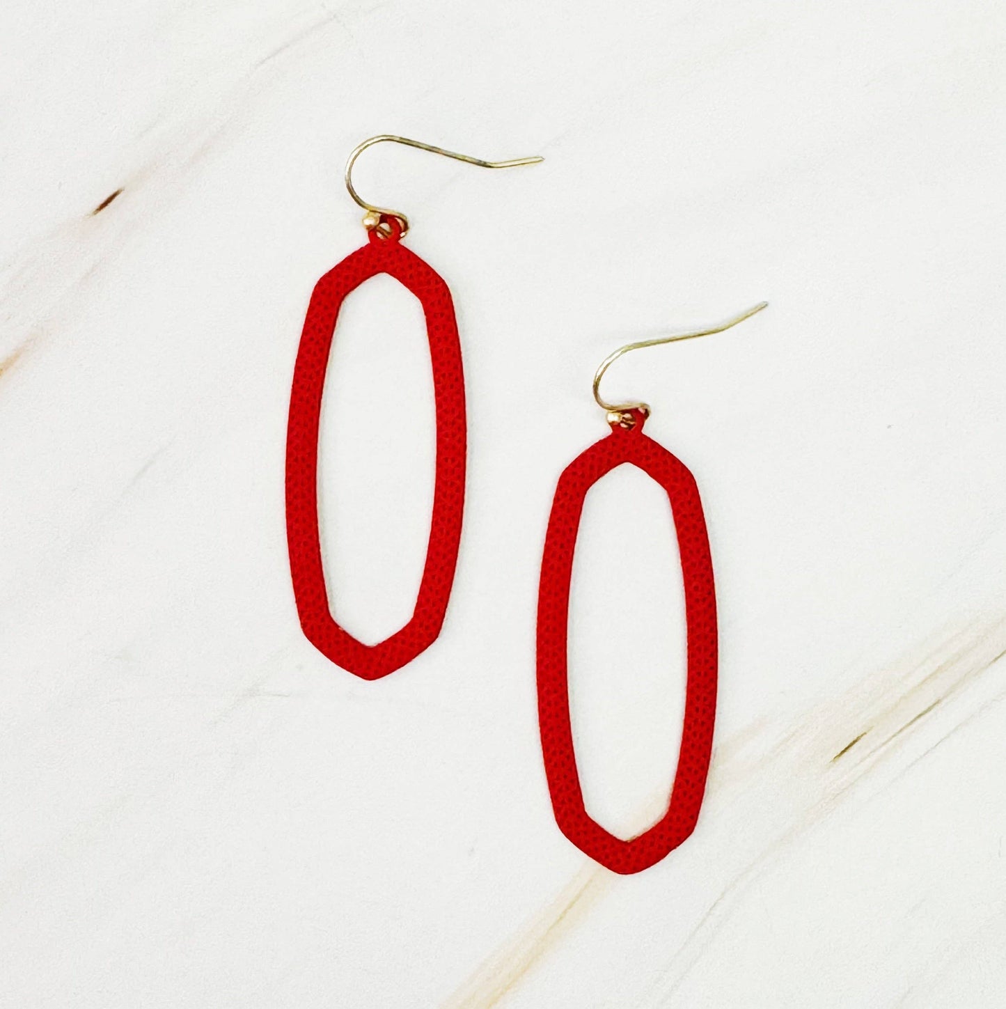 Ellison+Young Shape Of Game earrings featuring geometric design in silver with polished finish, close-up view.