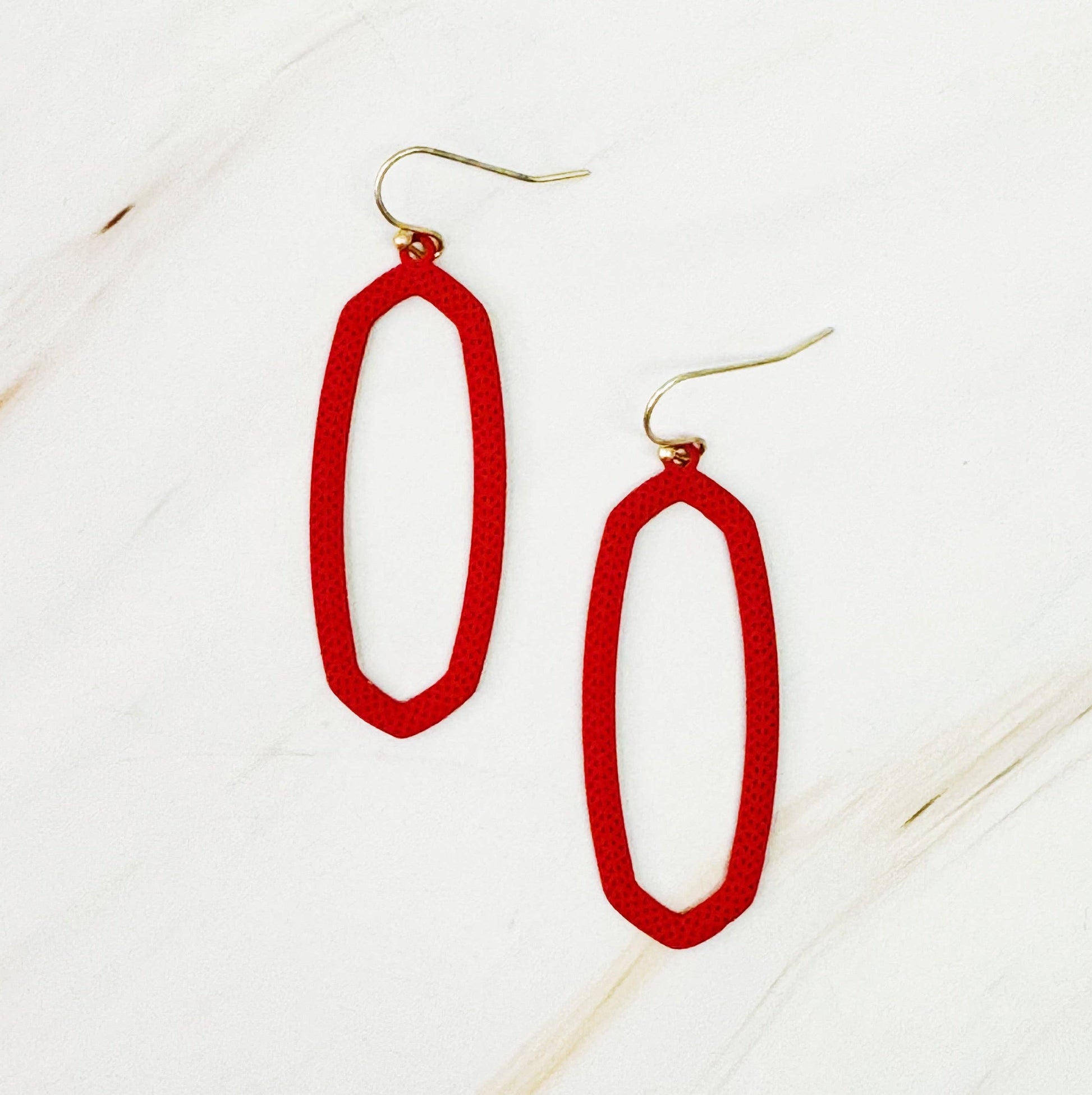Ellison+Young Shape Of Game earrings featuring geometric design in silver with polished finish, close-up view.