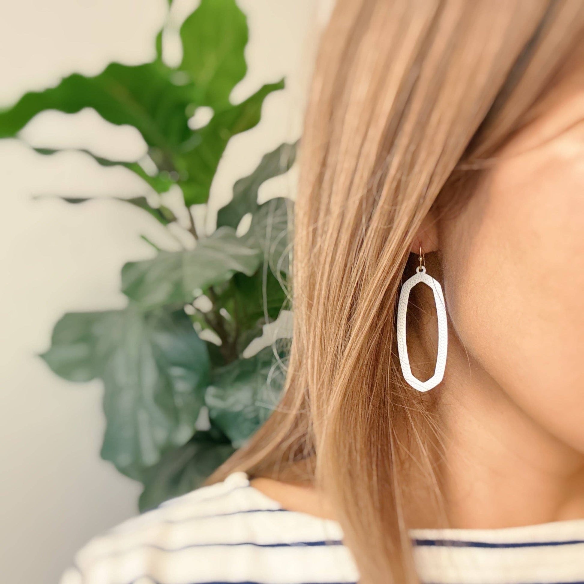Ellison+Young Shape Of Game earrings featuring unique geometric design in silver, close-up view showing detailed craftsmanship
