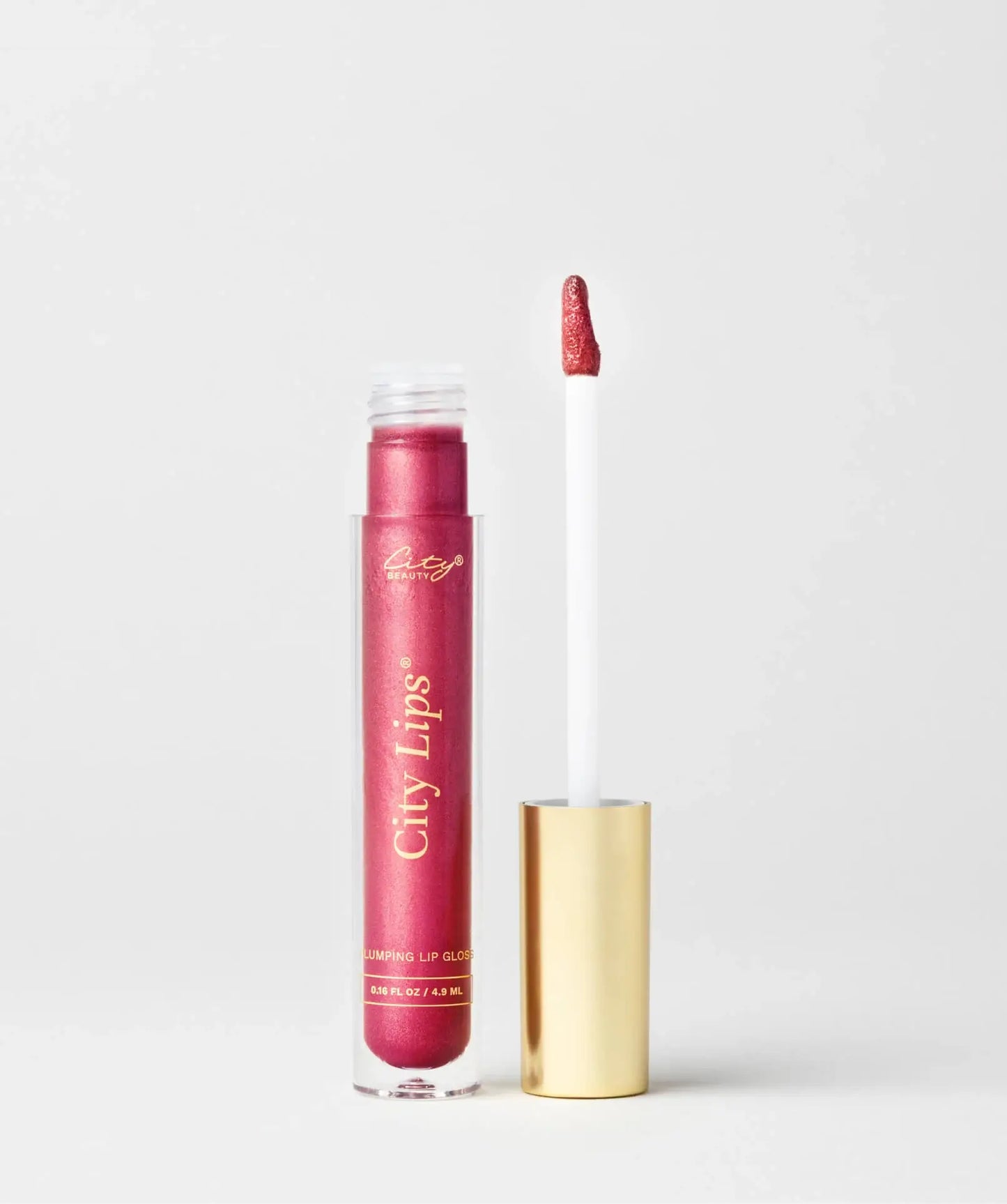 City Lips raspberry lipgloss with shimmery berry finish, glossy and vibrant, featuring a smooth application and reflective shimmer.