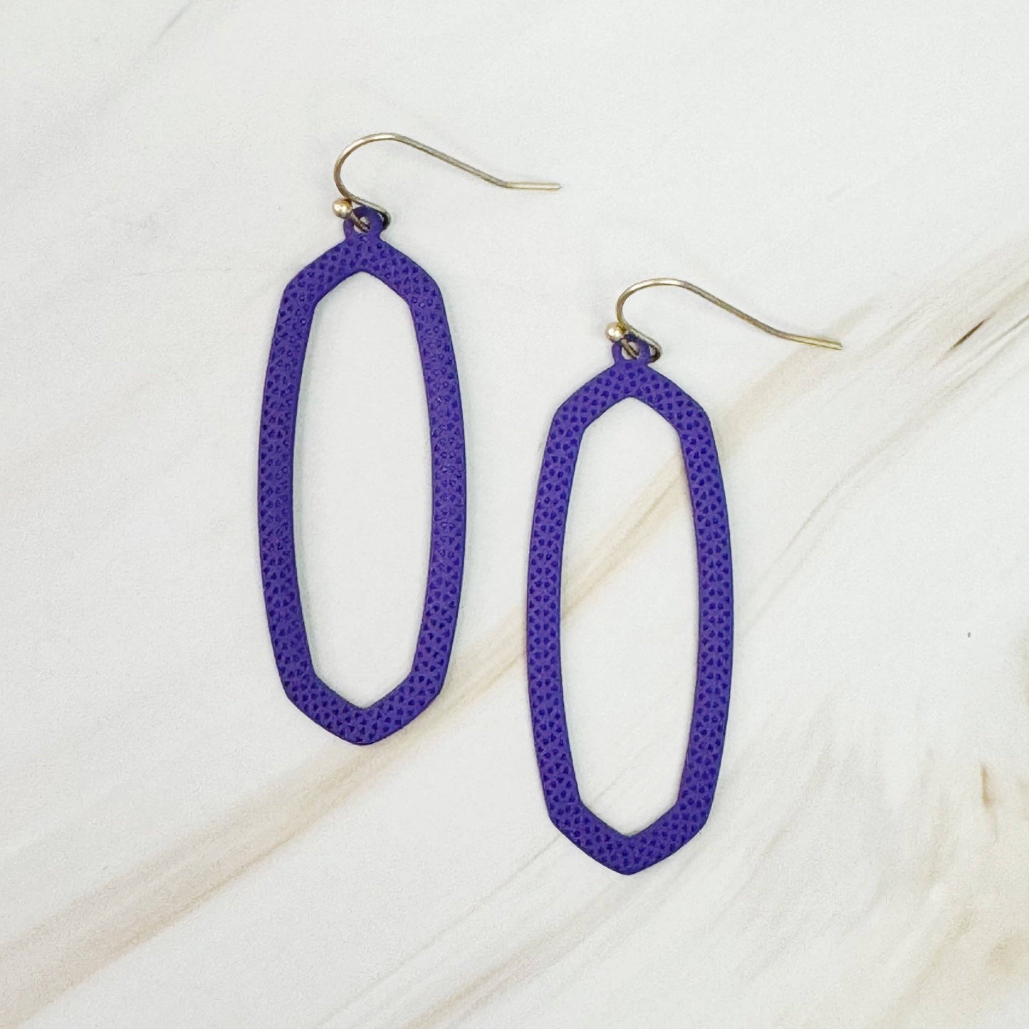 Ellison+Young Shape of Game earrings featuring sleek, modern design with geometric shapes in silver finish.