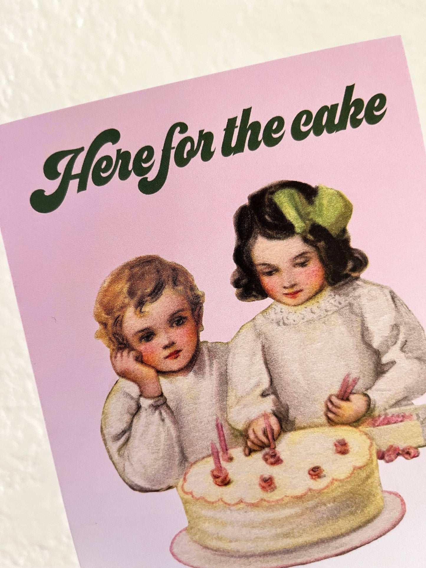 Funny birthday wedding celebration card from The Coin Laundry featuring humorous "Here for the Cake" message and colorful design.