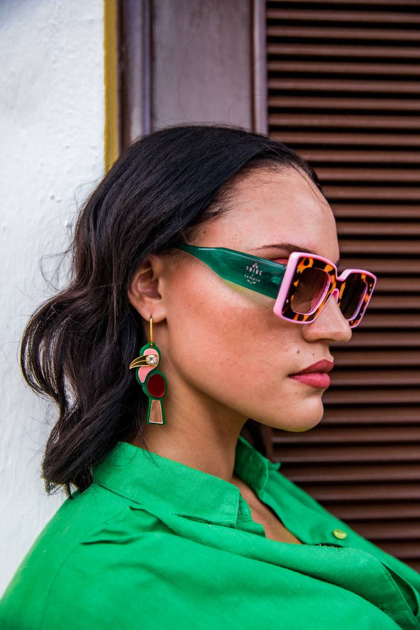 Tribe + Temple Deco sunglasses with bold geometric frames and tinted lenses, stylish eyewear for a modern look.