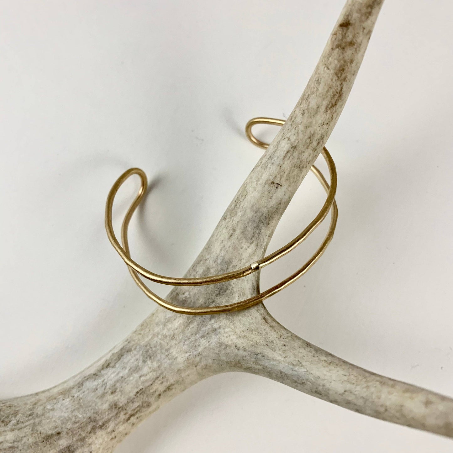 Handmade She-ra style cuff bracelet by Fluff Hardware featuring intricate metalwork and adjustable band design.
